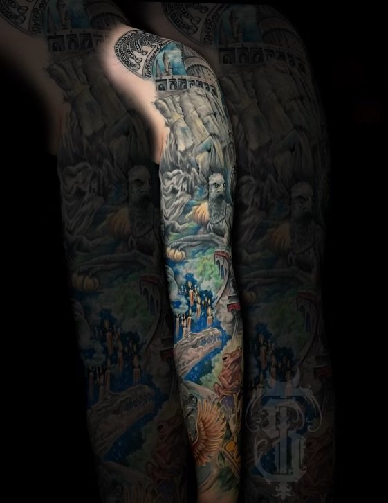 A person's arm and leg covered in a detailed, colorful tattoo sleeve and leg tattoo.