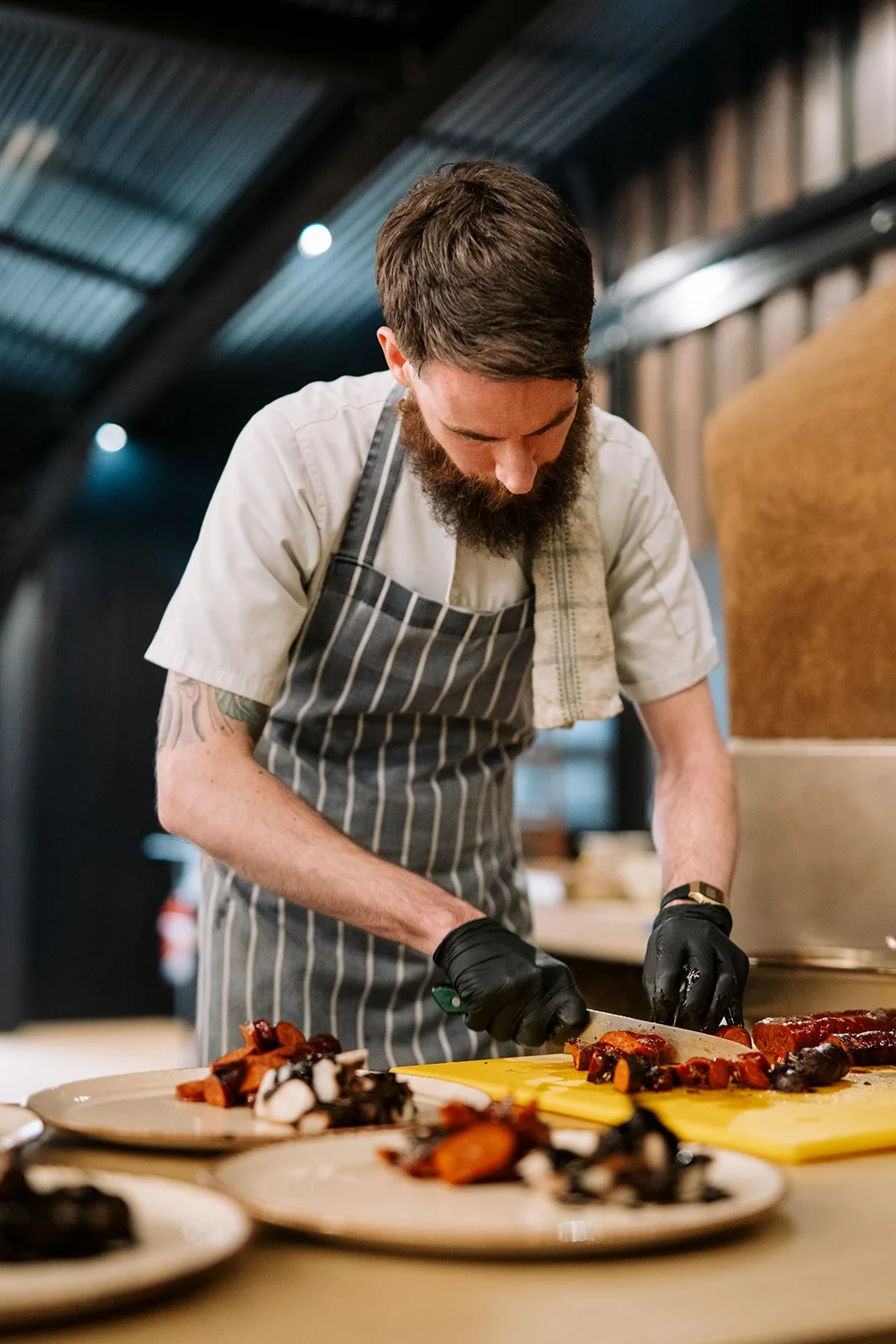 Pastry chef smiling ready for service.