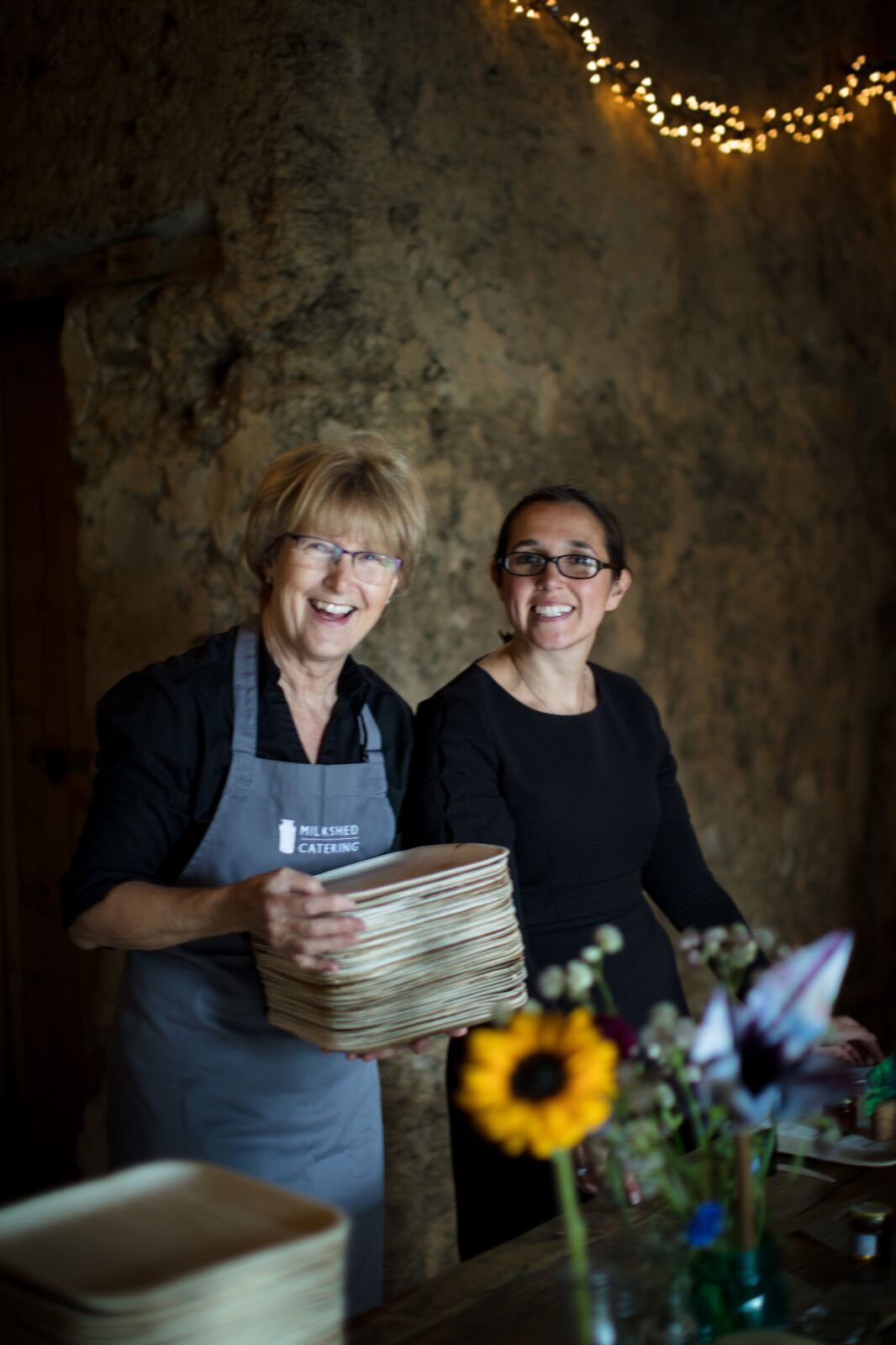 Wedding catering team laying tables at a Devon wedding.