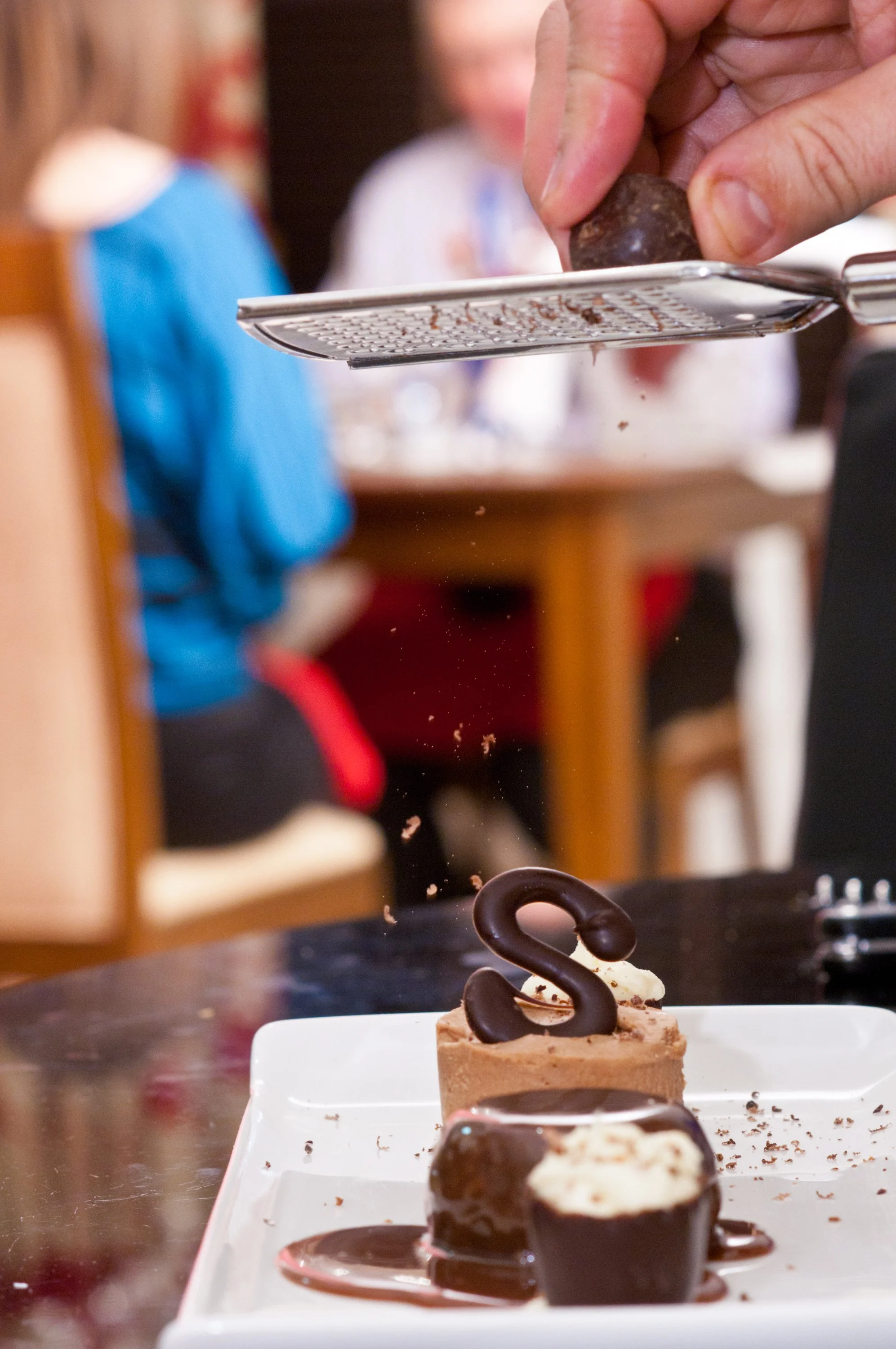 Chocolate praline with chocolate moulding & flakes