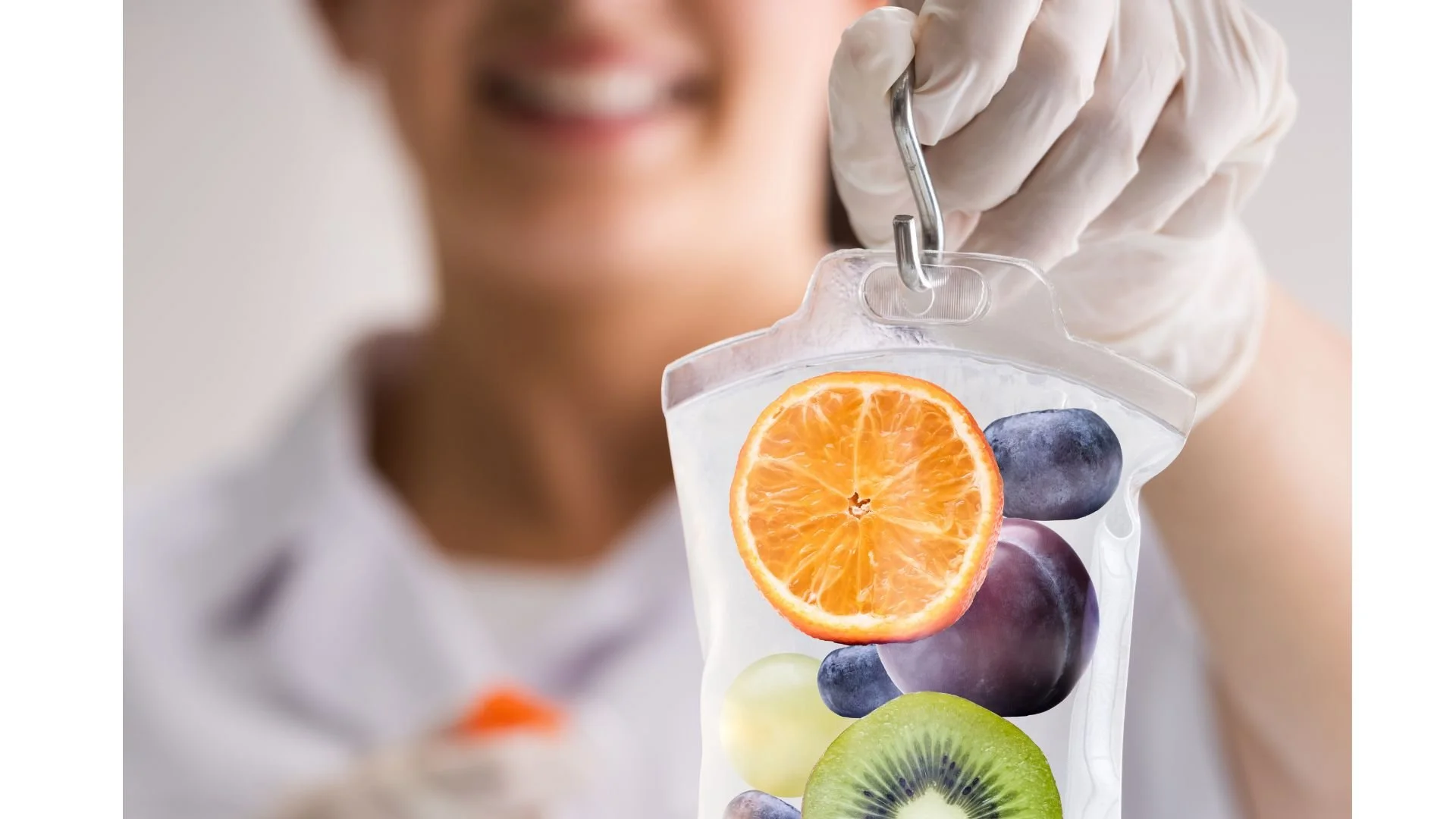 smiling person holding an iv bag with fruit in it, primary care services near me