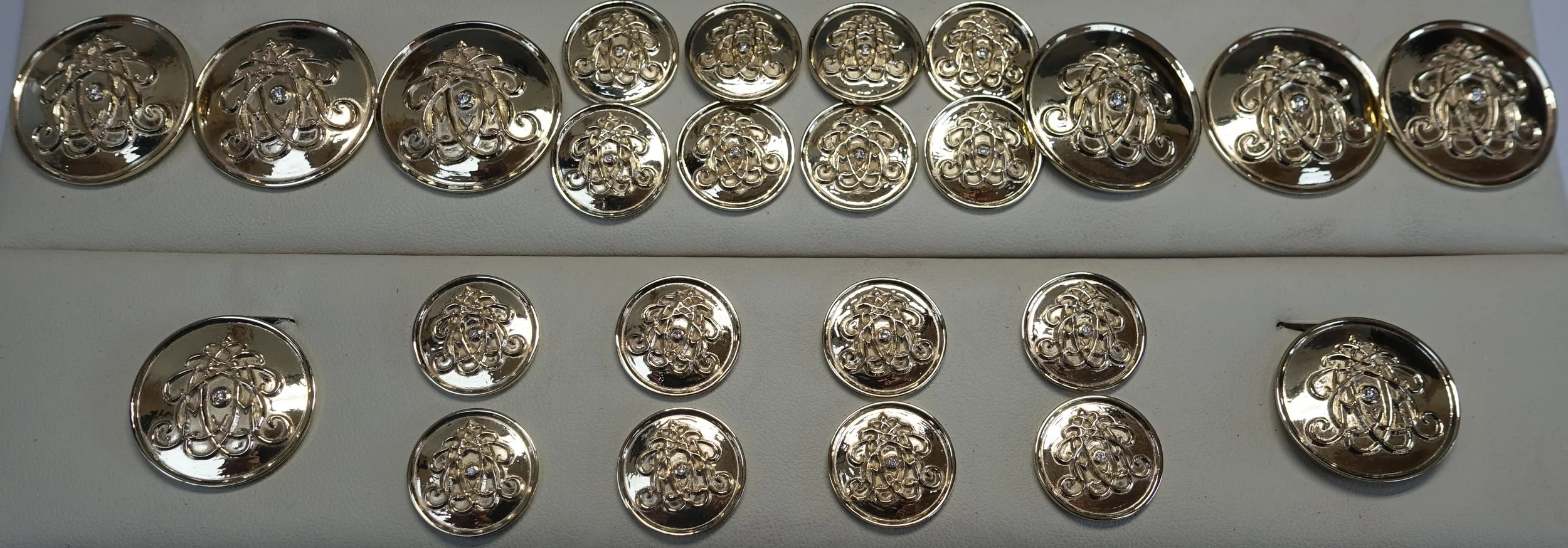 Gold buttons each set with a diamond and fit for a Prince.JPG