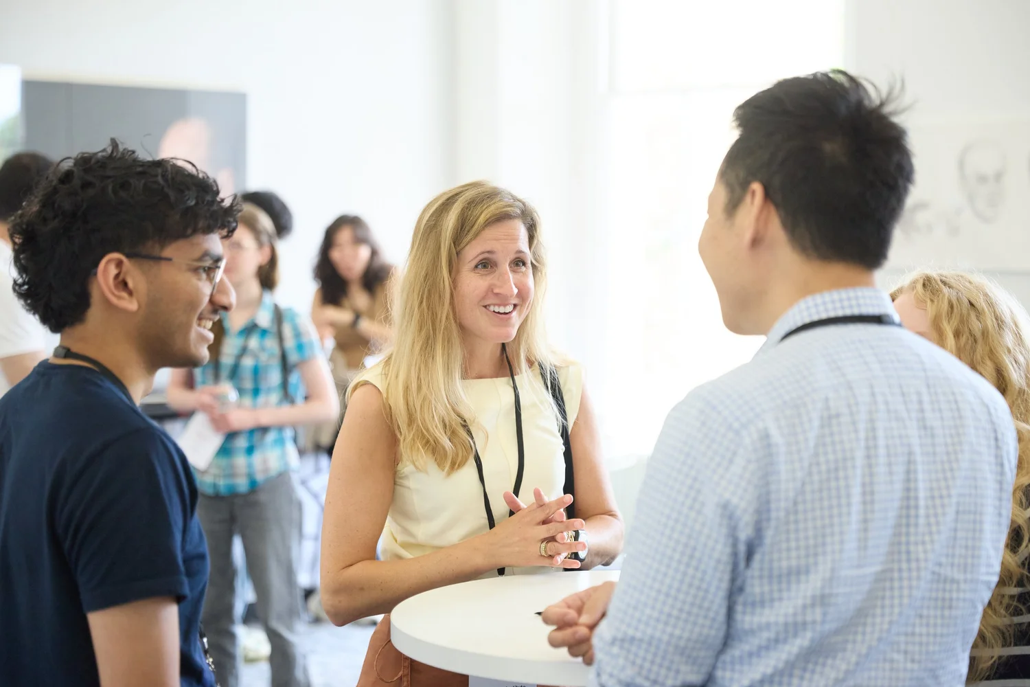 Attendees in conversation at an ERA event