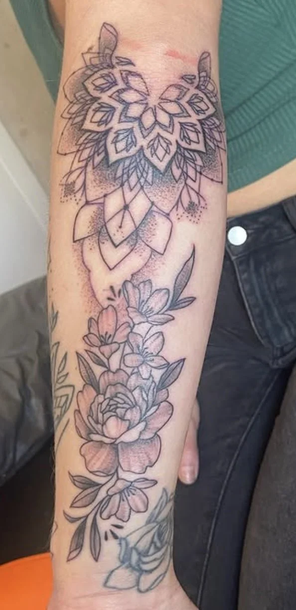 female mandala arm tattoo