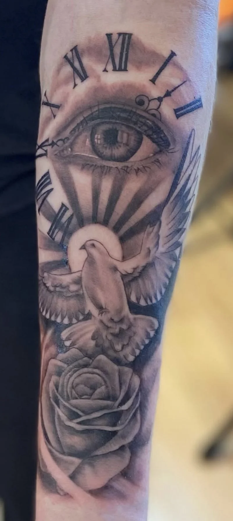 Clock , eye, dove and rose tattoo