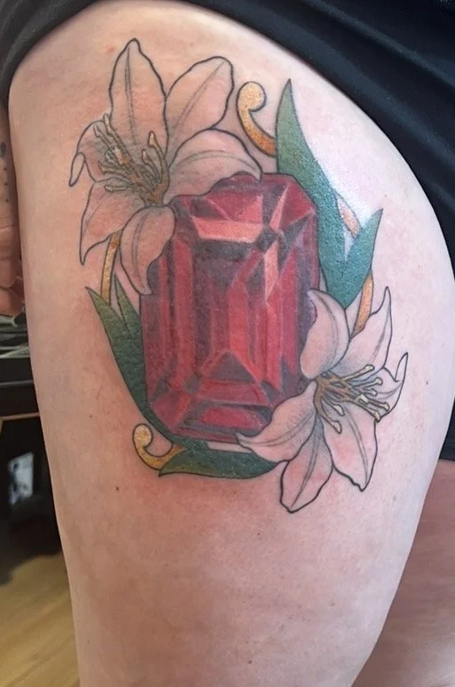 Rubis gem tattoo with lili flower in colours