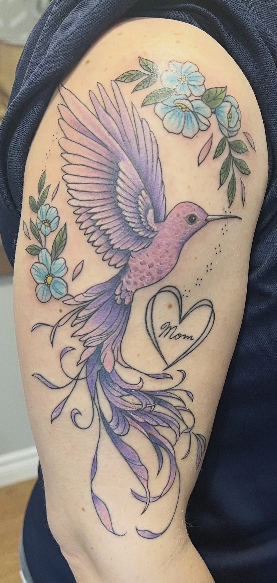 feminine hummingbird with flower in colours