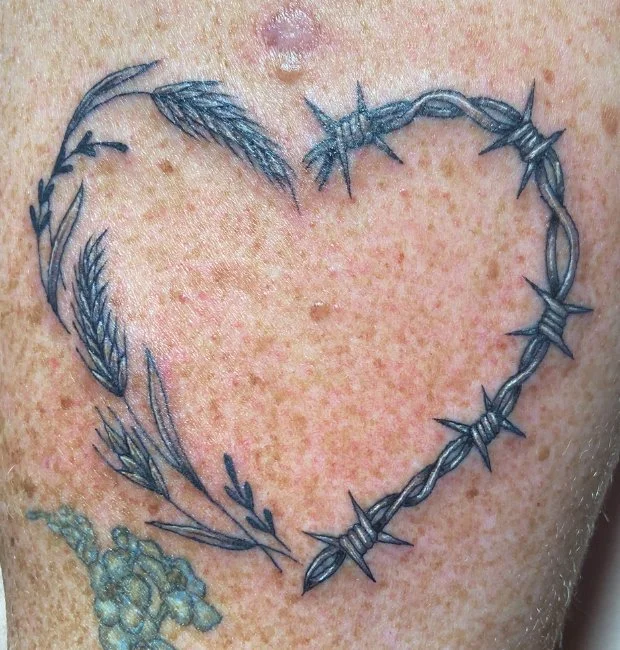 Barbwire and nature tattoo design