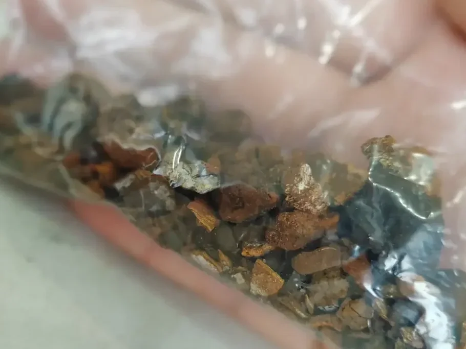 A plastic bag filled with rocks and gravel.