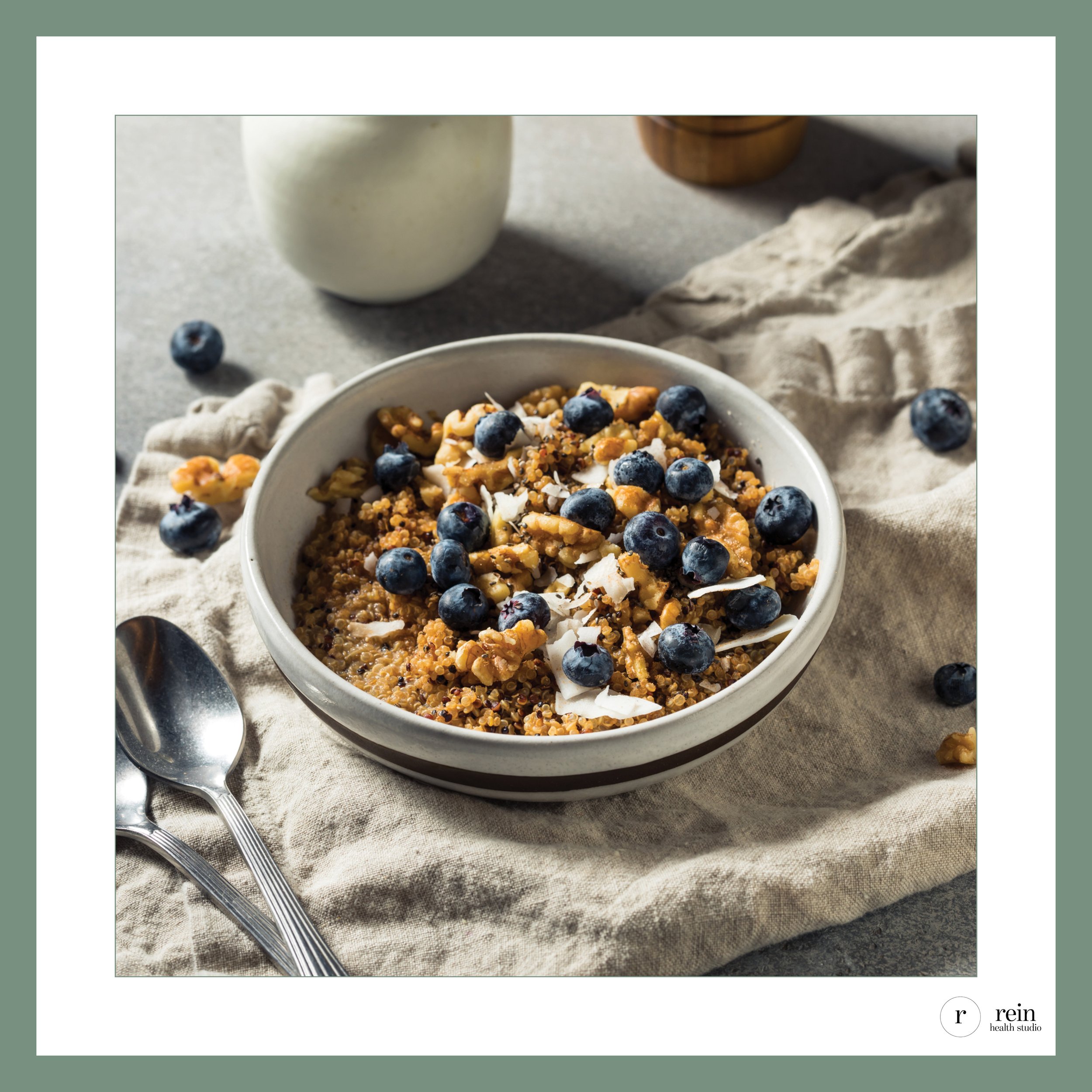 Warm Quinoa Breakfast Bowl w/ Blueberries + Coconut Shavings