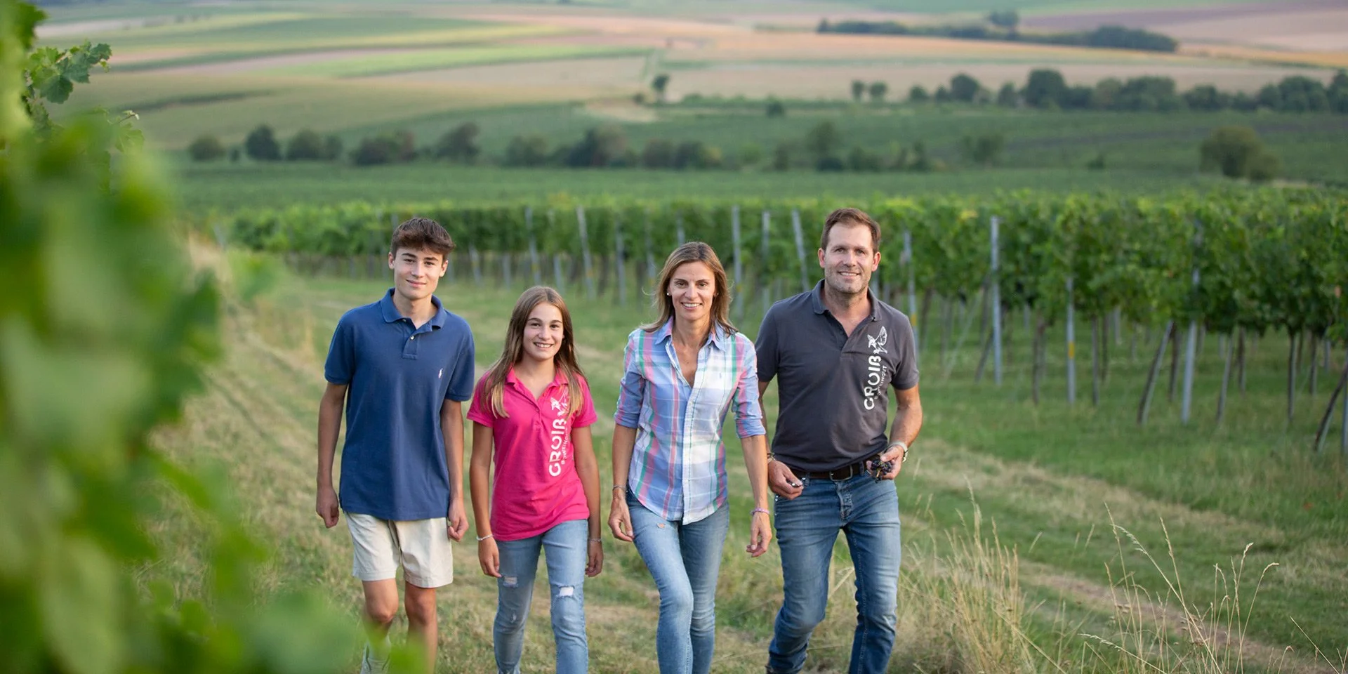 The Groiss winemaking family walking through their vineyard in Wagram, Austria