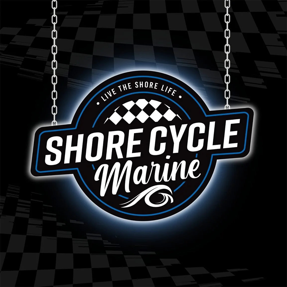 A neon sign for Shore Cycle Marine with the slogan "Live the Shore Life."