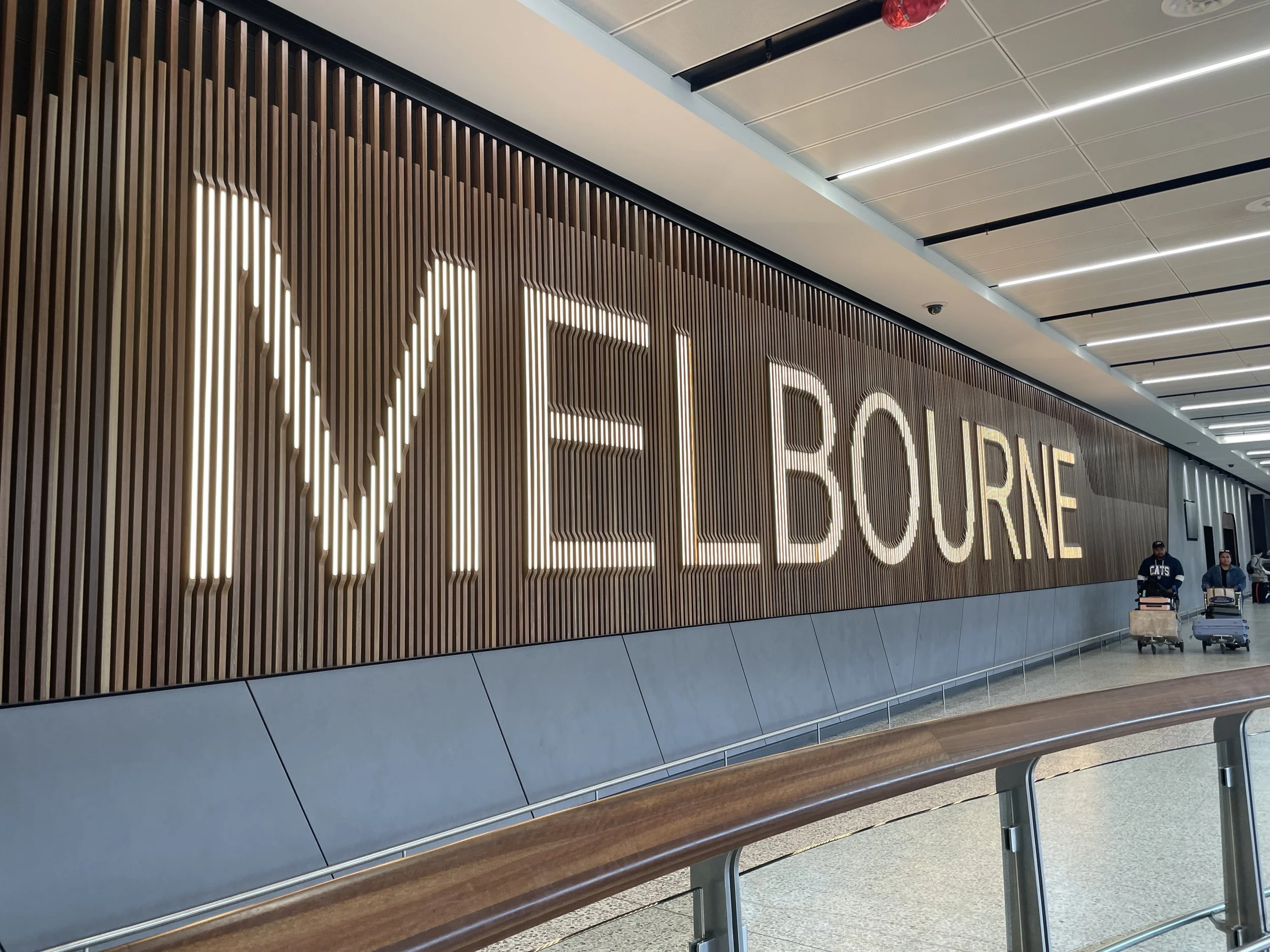 AUS>LAX>HKG>MEL