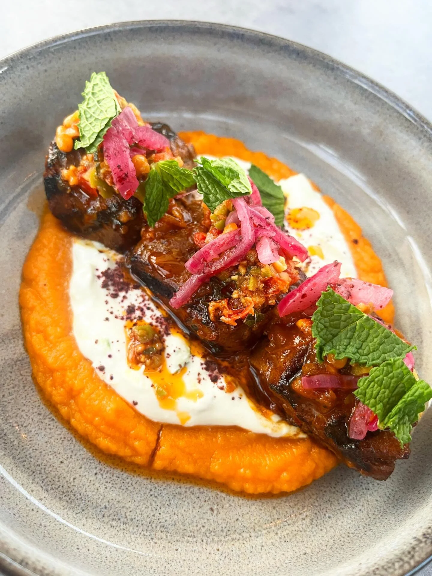 Grilled Venison |  moroccan date sauce, sweet potato puree, cucumber yogurt, sumac onion, olive &amp; tomato tapenade, pine nut and mint. 

Have you tried it yet?

#stayeasy