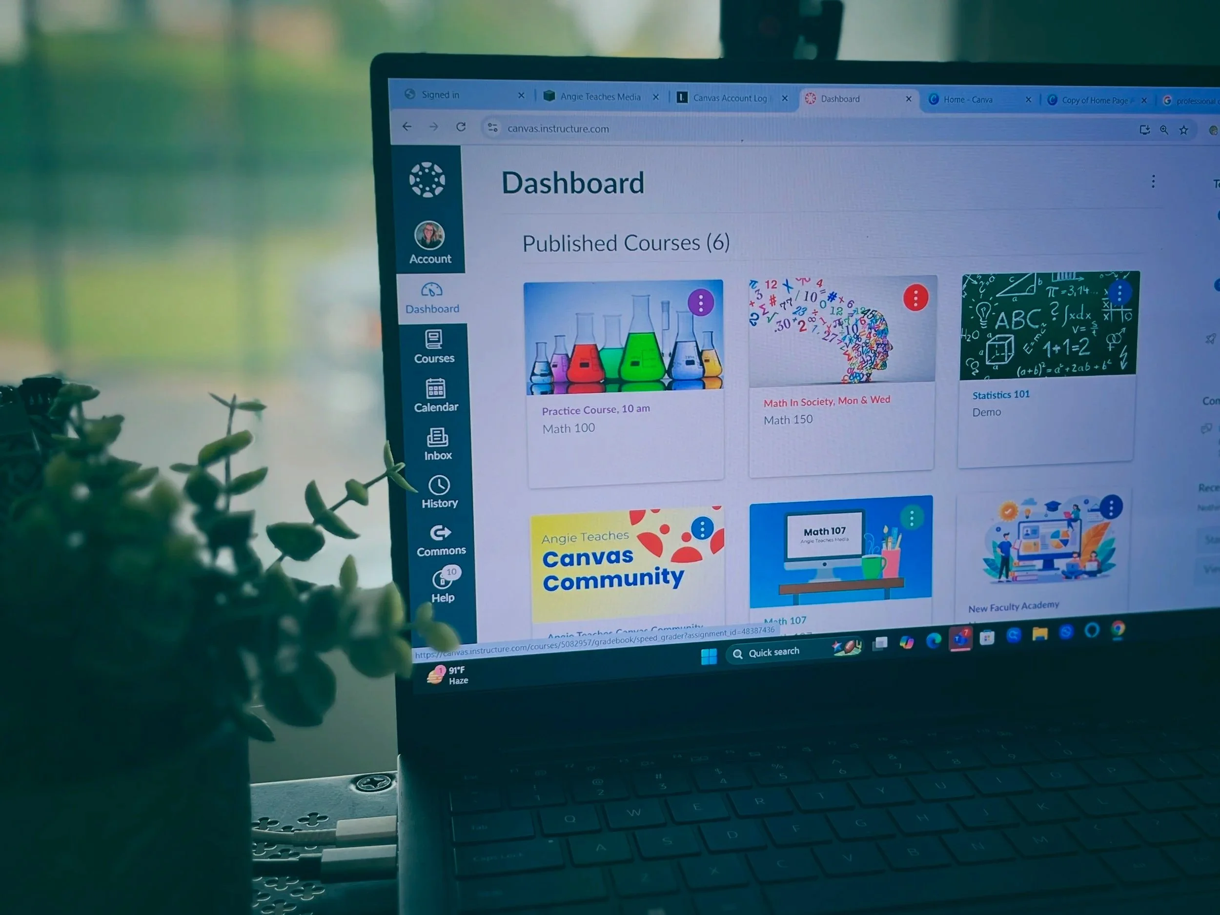 Laptop open to Canvas LMS Dashboard