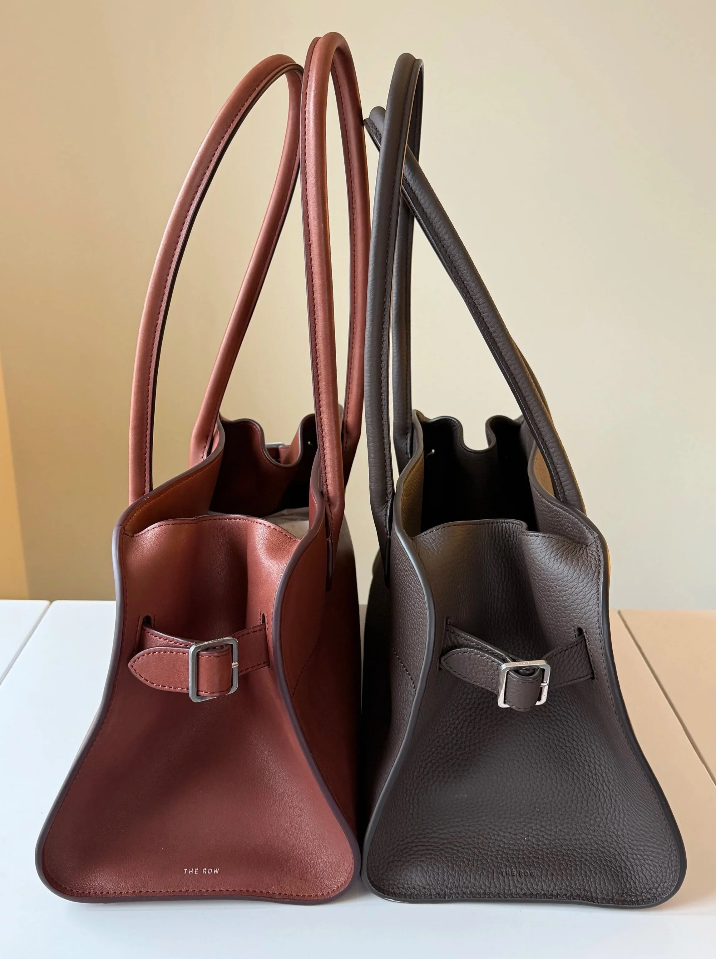 Side view comparison of the polished vs. grained leather finishes of the Row Margaux Shoulder 12