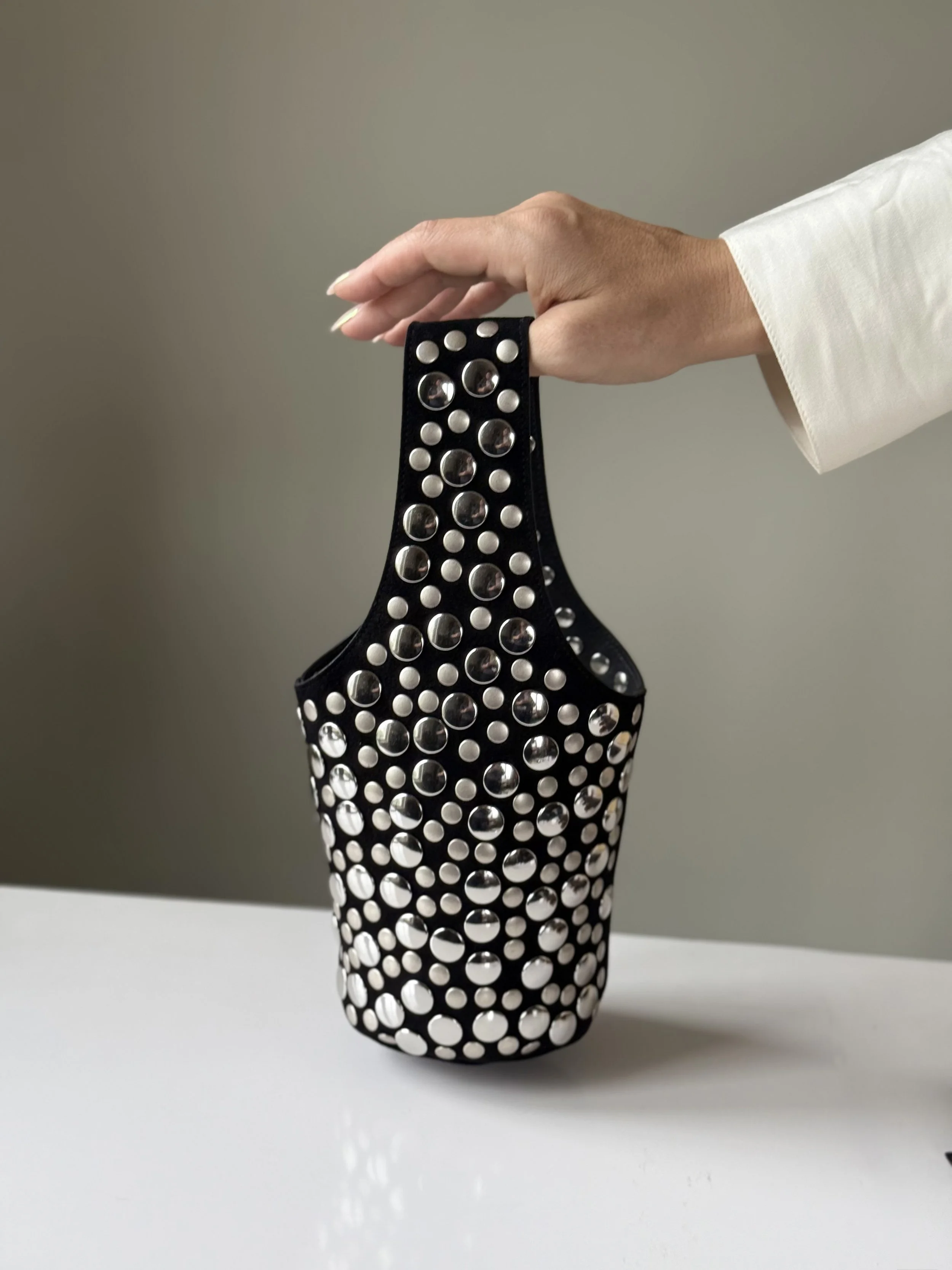 Khaite Livia bag in black leather with silver hardware on display — featured on Violetta’s Bags for its sculptural form and edgy appeal.