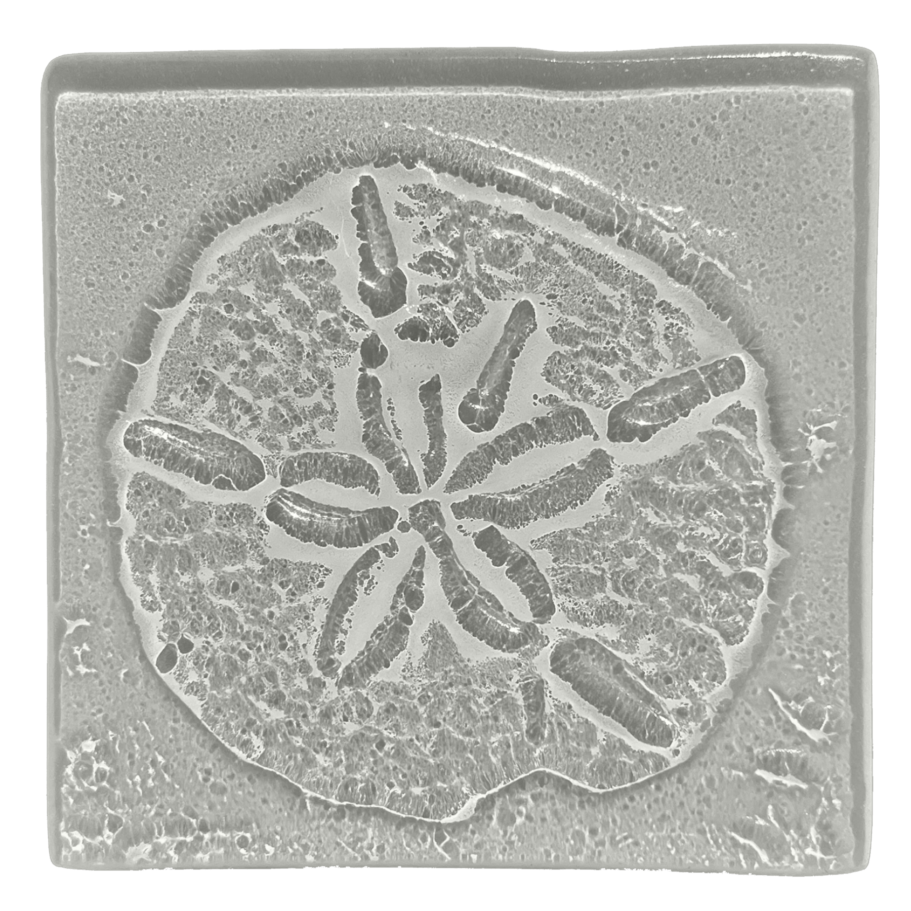 A grayscale close-up of a carved soap with a lemon slice design, showing detailed textures and patterns.