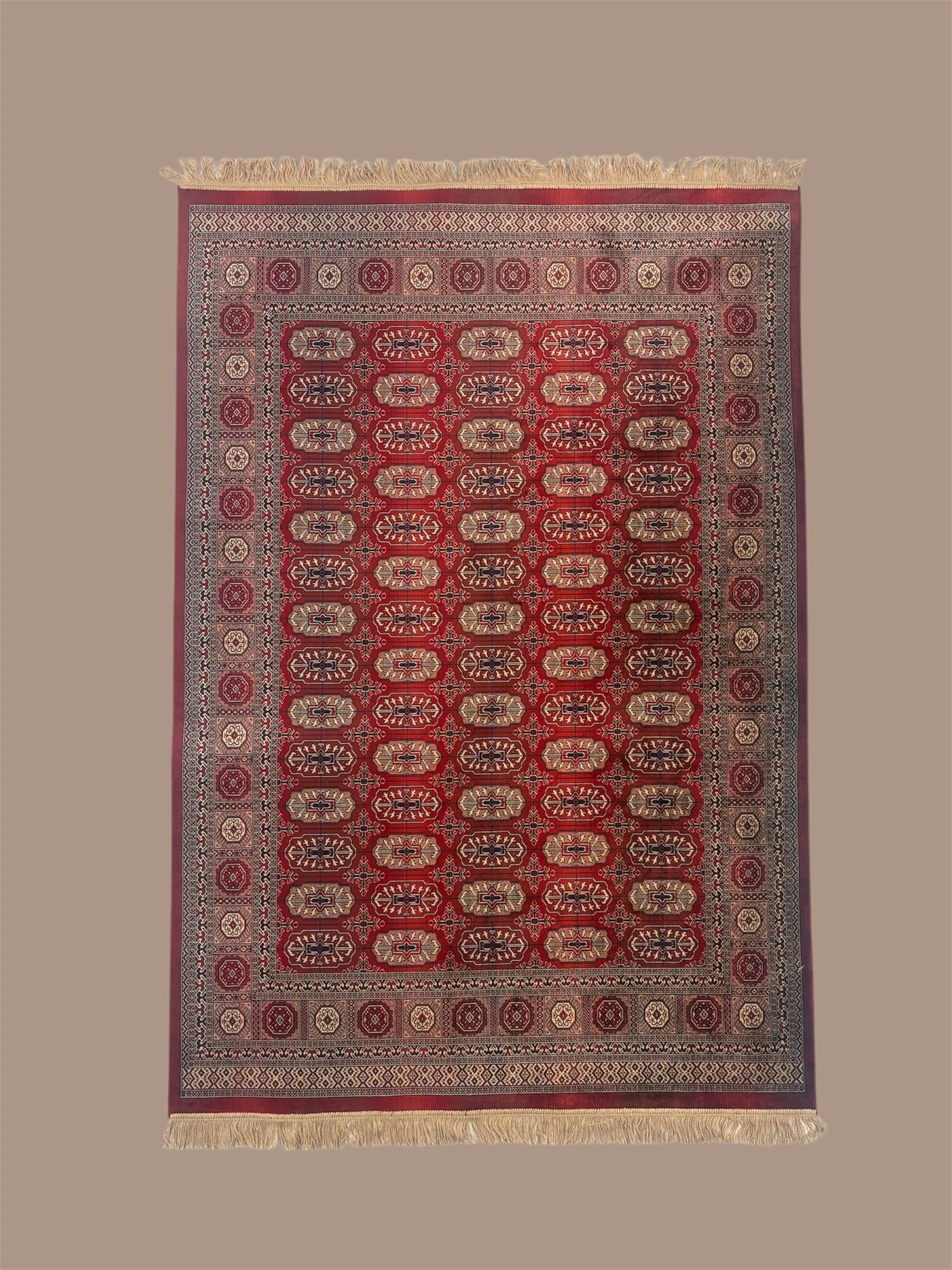 A traditional Persian-style rug with intricate geometric and floral patterns in red, black, beige, and white, bordered by multiple decorative borders and fringes at the top and bottom.