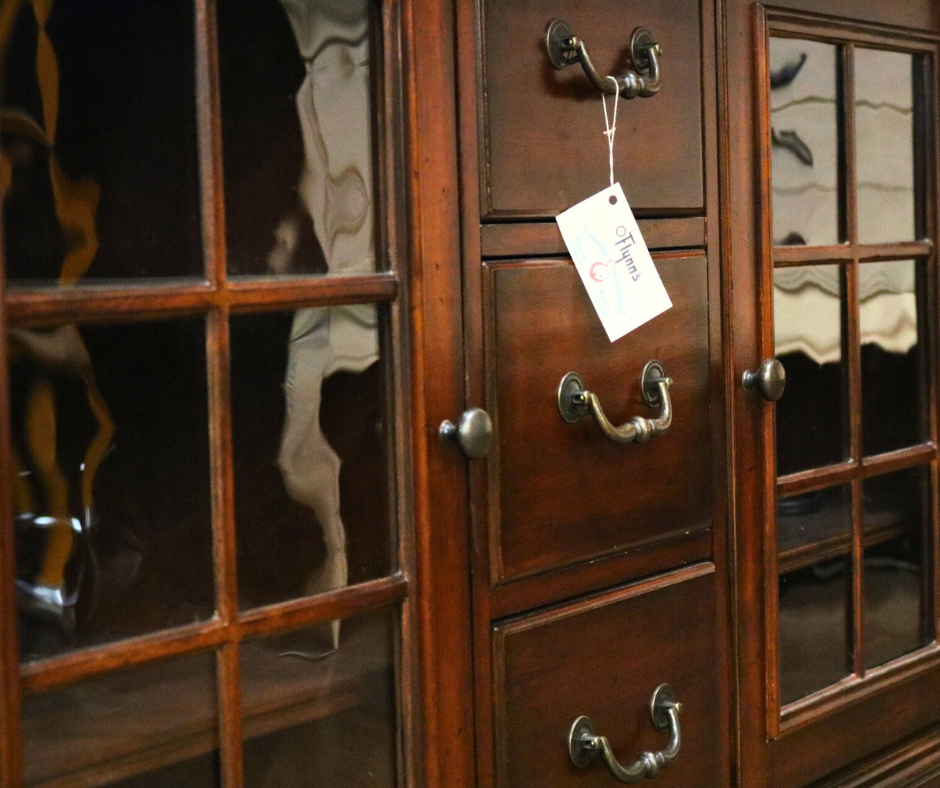 Close-up shot of vintage wood cabinet with glass panes