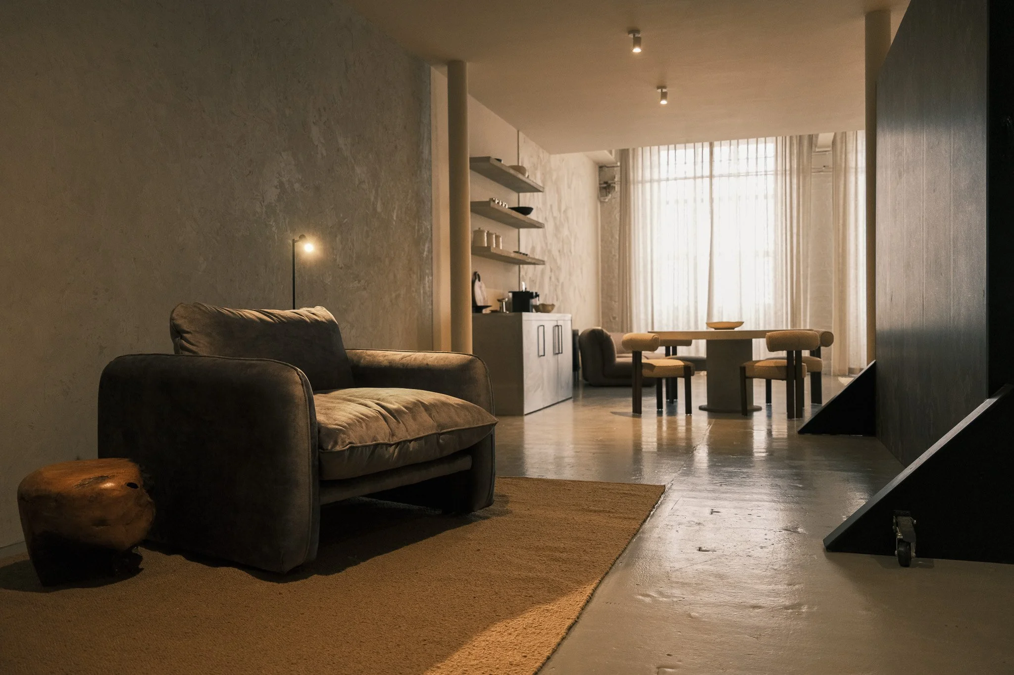 Lifestyle studio set at ACAI Studios Manchester with sofa, dining area and kitchen backdrop designed for brand and content photography