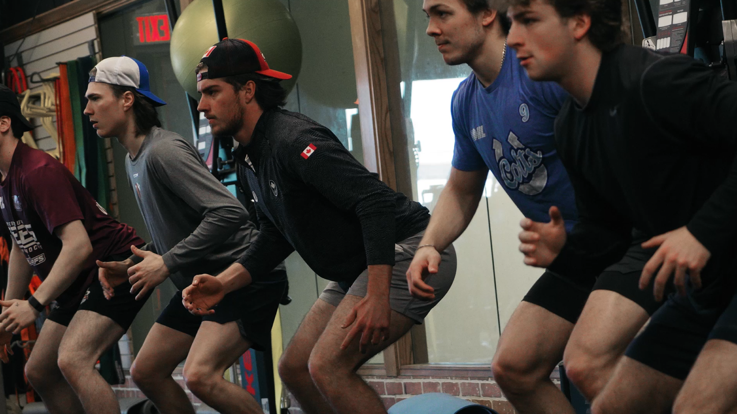 Athletes in a ready stance during team training