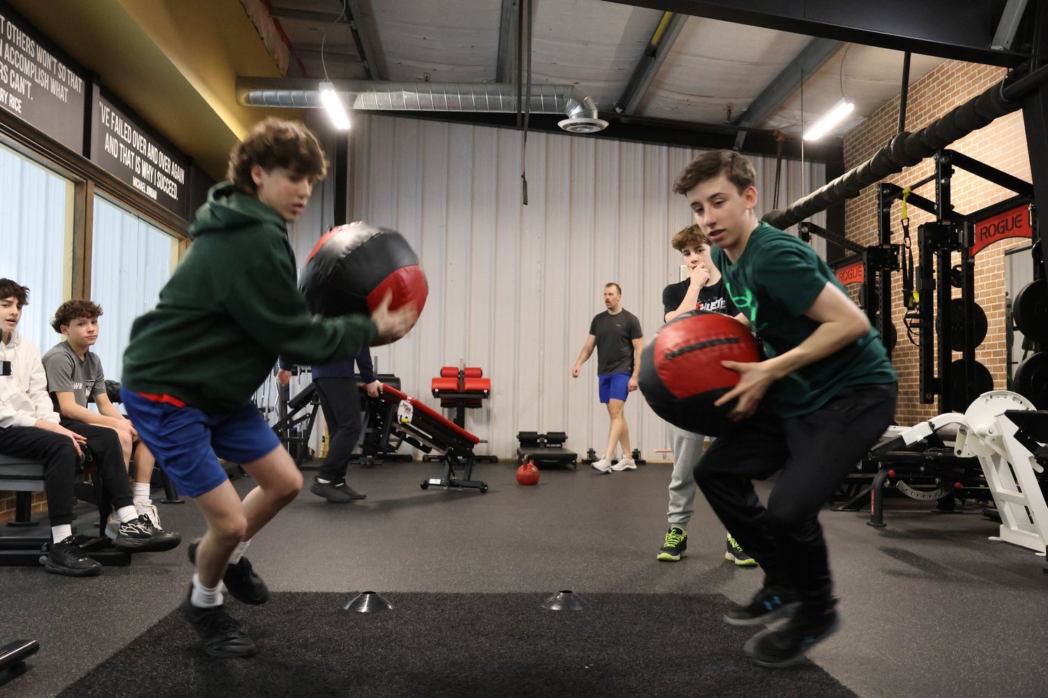 Young athletes training with medicine balls at SHIELD