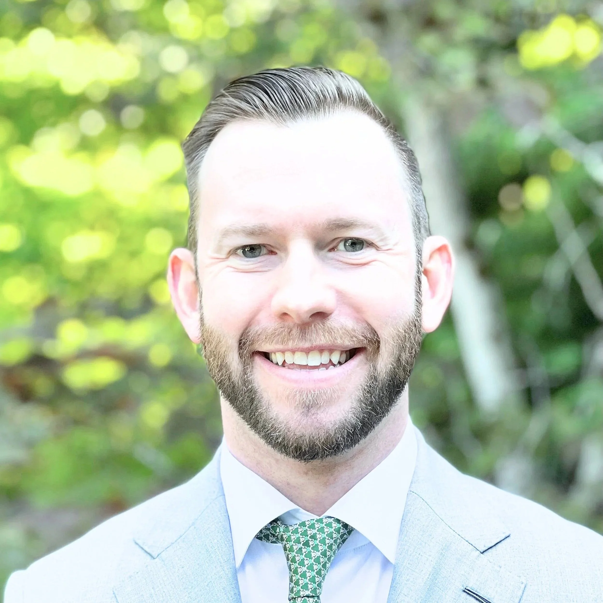 head profile picture of white man with close beard.