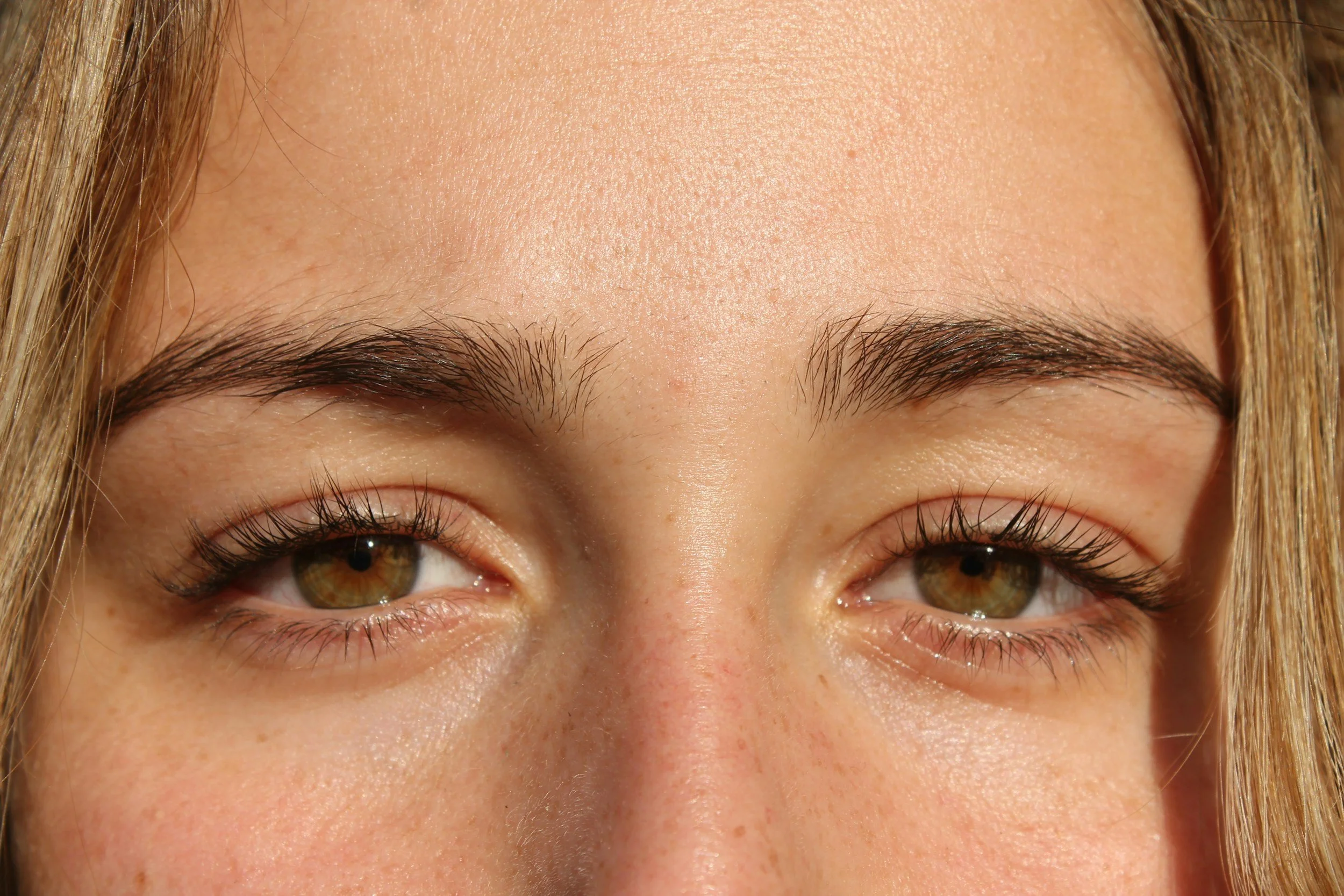 Close-up of a woman’s eyes conveying reflection and hope for trauma therapy and anxiety support in Arizona.