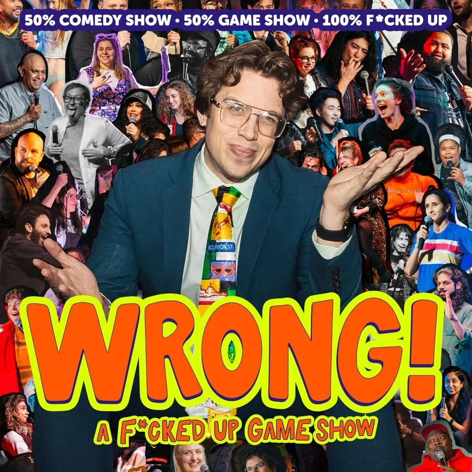 Performers on stage at a comedy show titled 'Wrong! A Fucked Up Game Show' with a large pink sign overhead.