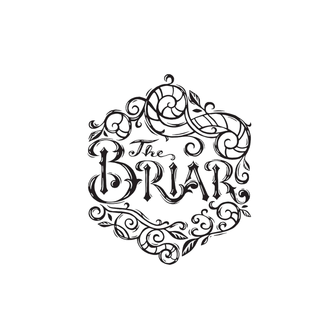 Decorative black wrought iron sign reading "The Briar" with ornate floral scrollwork design.
