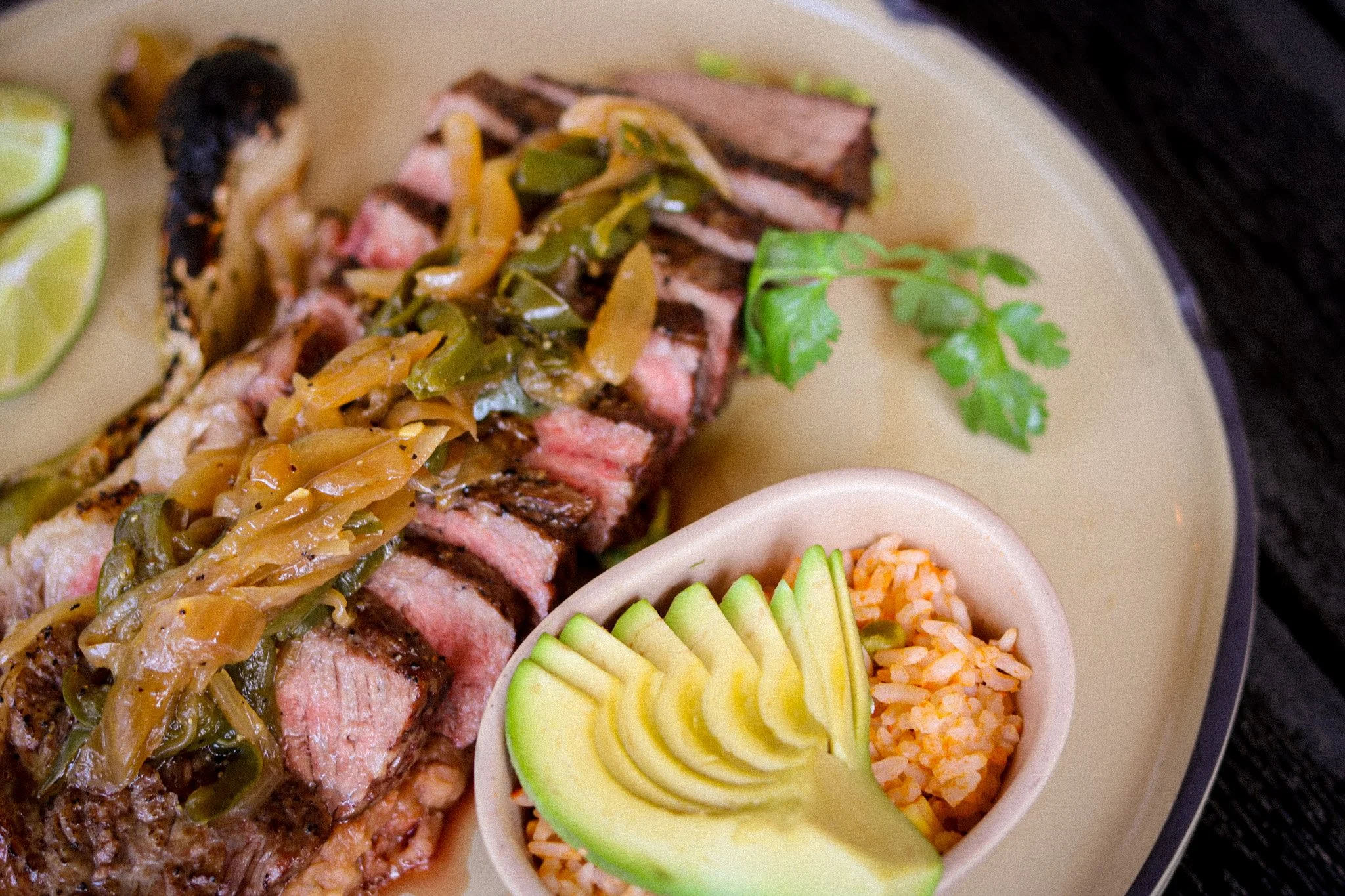 Meet the Chulet&oacute;n &mdash; our showstopper. 🥩🔥
A perfectly grilled rib eye, sliced to reveal that gorgeous medium-rare centre, topped with caramelized onions and chiles toreados, served with fresh avocado and Mexican rice.
This is the kind of