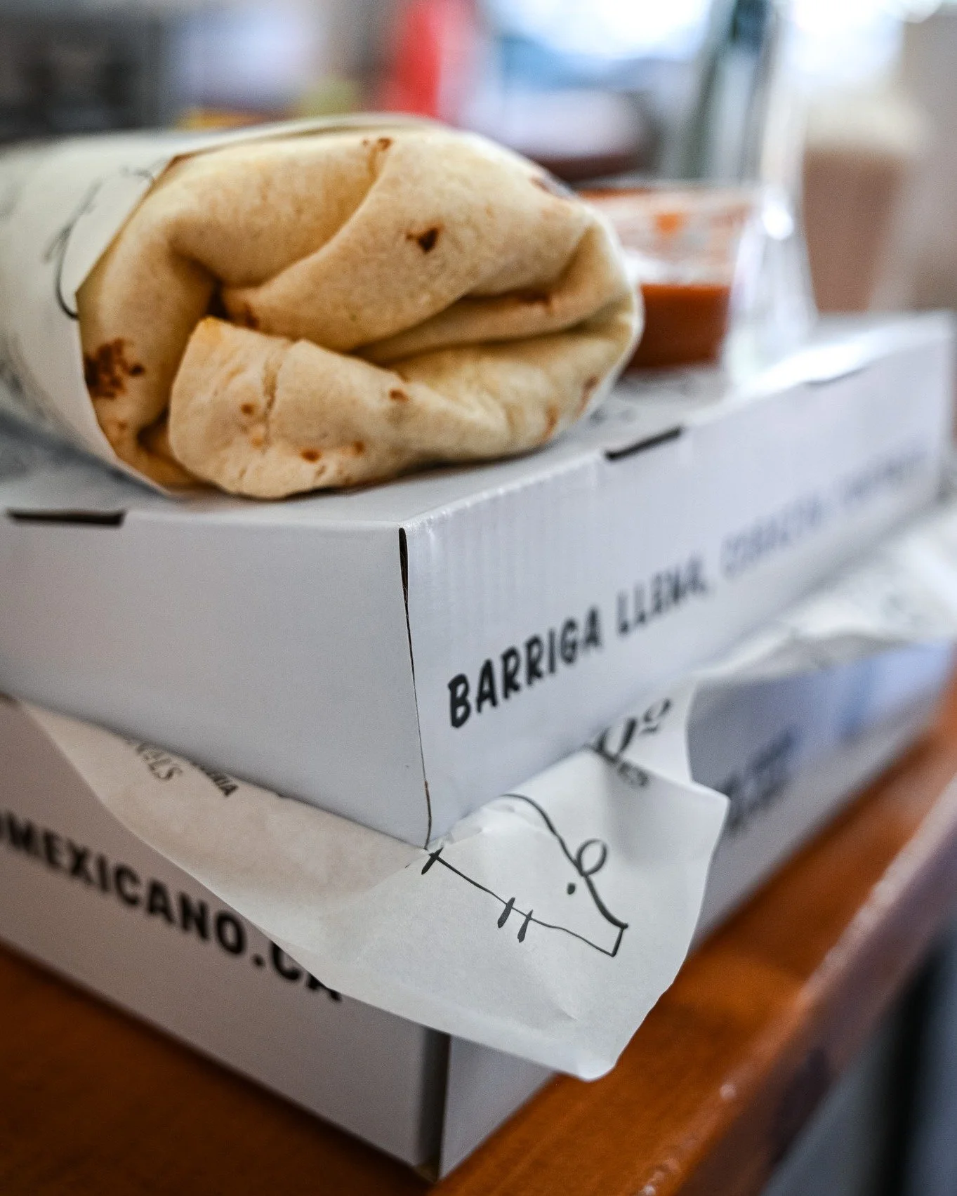 "Barriga llena, coraz&oacute;n contento." 🌯❤️
Full belly, happy heart &mdash; one of Mexico's most beloved sayings, and a philosophy we live by.
A hand-rolled burrito on a fresh flour tortilla, salsa on the side, ready to make your day bet