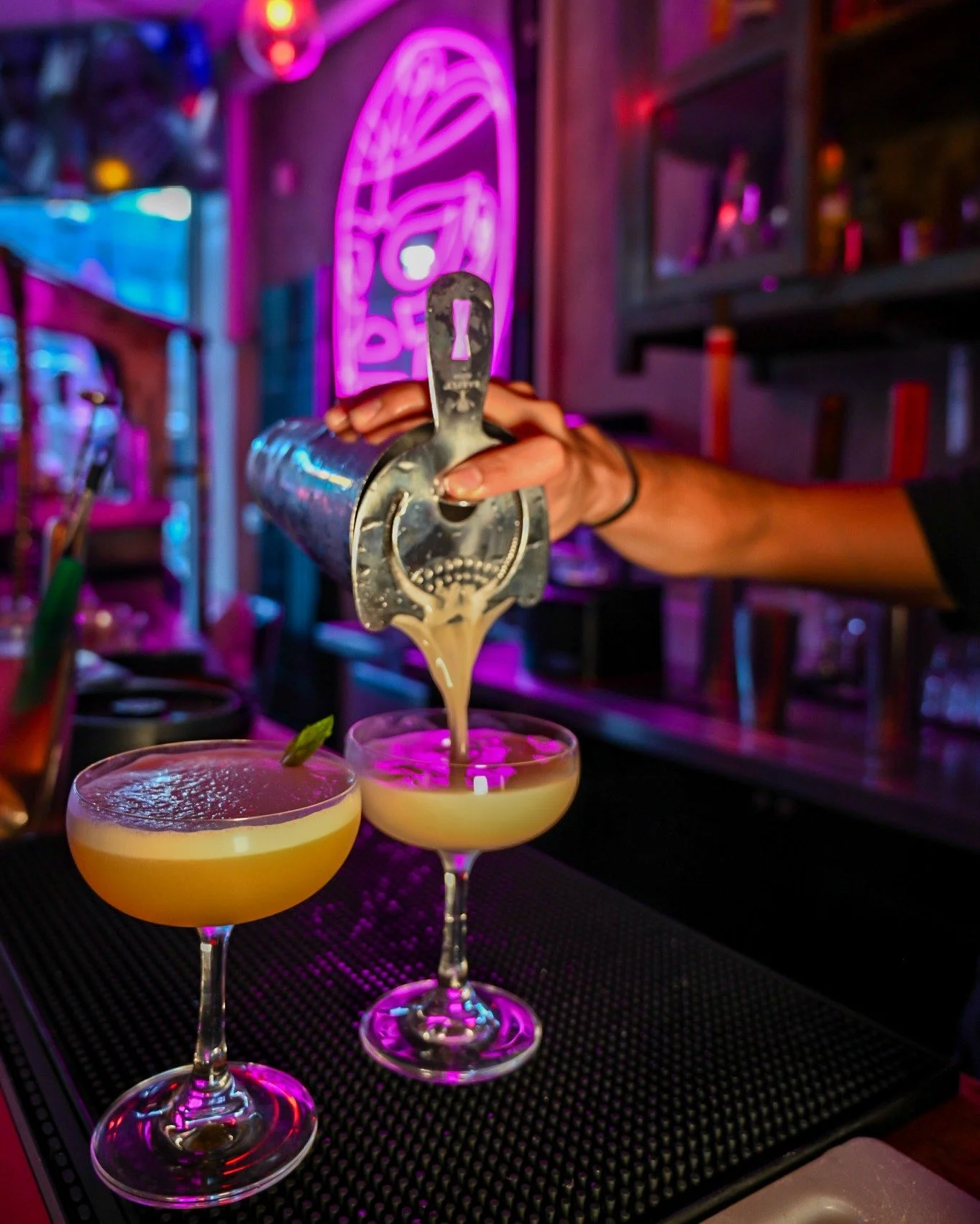 Two coupes. One bartender. La barra in full effect. 🍸💗
Behind every cocktail at Lucha Libre is a story &mdash; each drink named after a luchador, each build designed to capture their fight style: bold, smooth, smoky, or sweet.
That magenta glow isn