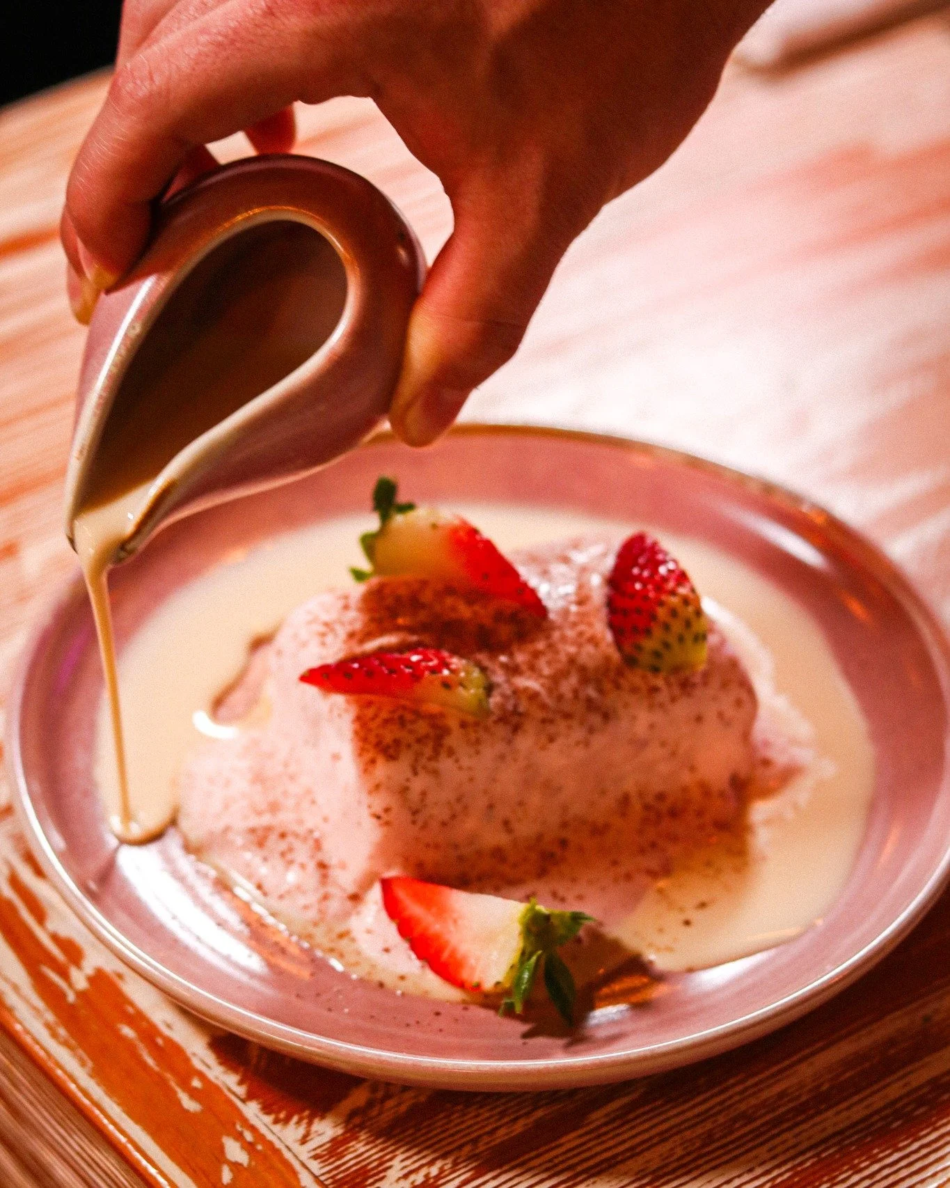 Tres leches &mdash; the Latin American dessert that turned three milks into one obsession. 🥛✨
Our Pastel Fresa Lechero is an orange-vanilla sponge soaked in tres leches with a hint of rum, topped with strawberry whipped cream and finished tableside 