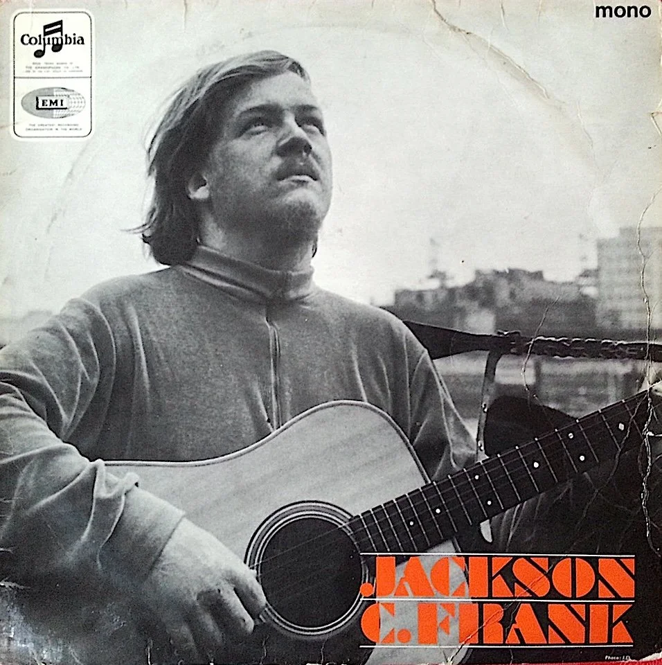 Cover of Jackson C. Frank (1965), showing Jackson C. Frank holding an acoustic guitar, photographed in London for his only studio album produced by Paul Simon.