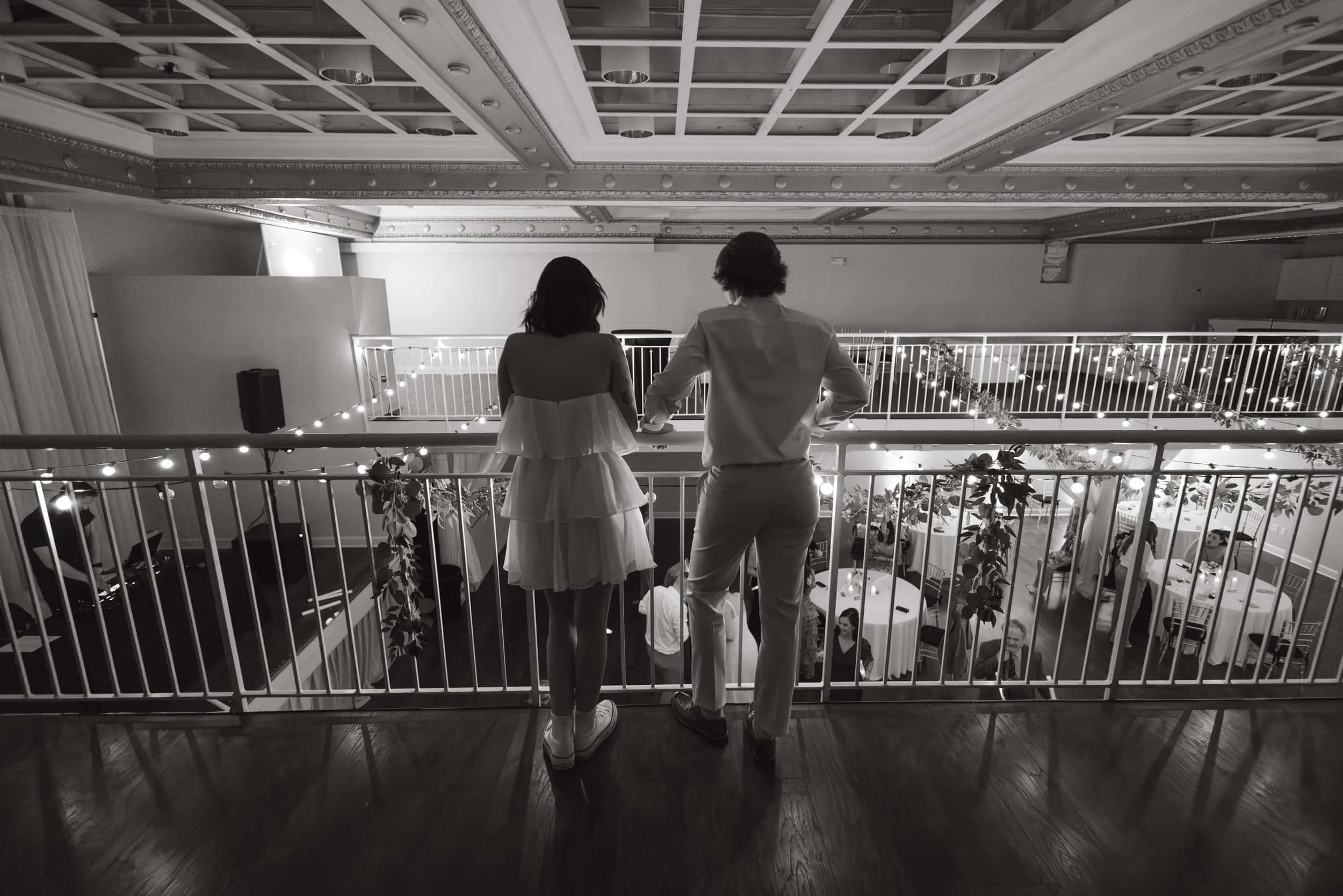 Autumn's Wedding Clients Kathryn & Faith admiring their wedding guest from above soaking in the moment together