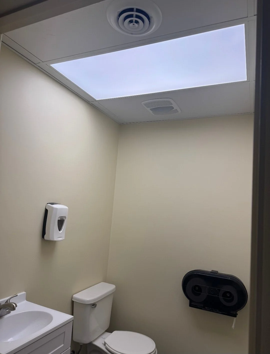 New ceiling, floor, walls, and vanity installed. 