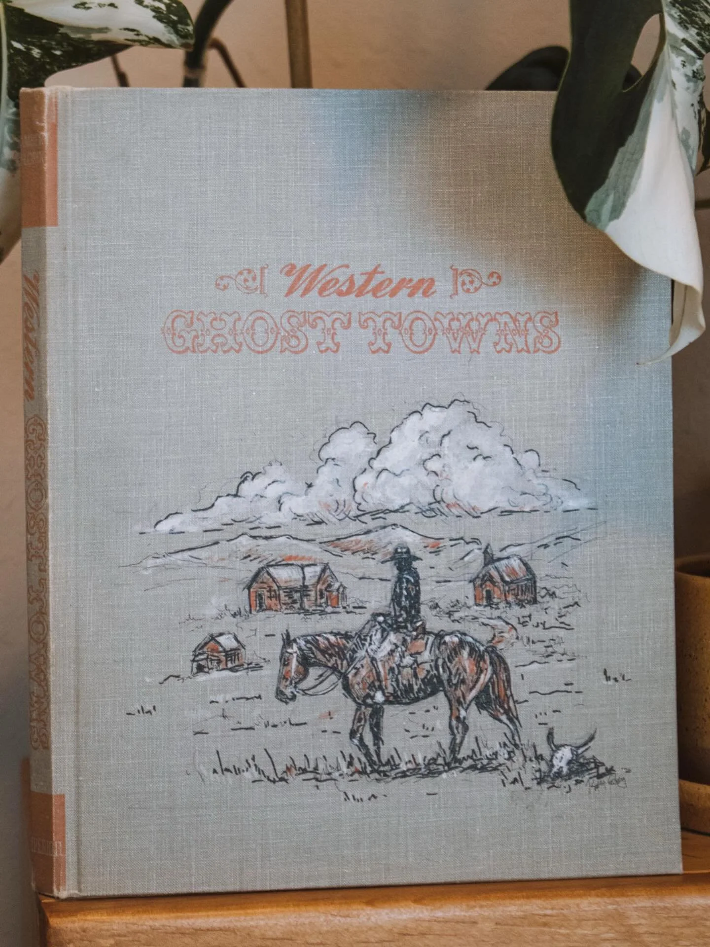 Close-up of the painting I did on this 1961 Western Ghost Towns book. It was interesting to  experiment with a pop of color that matches the text and binding. 

I feel like book covers are a canvas that comes with built in inspiration.  This book is 