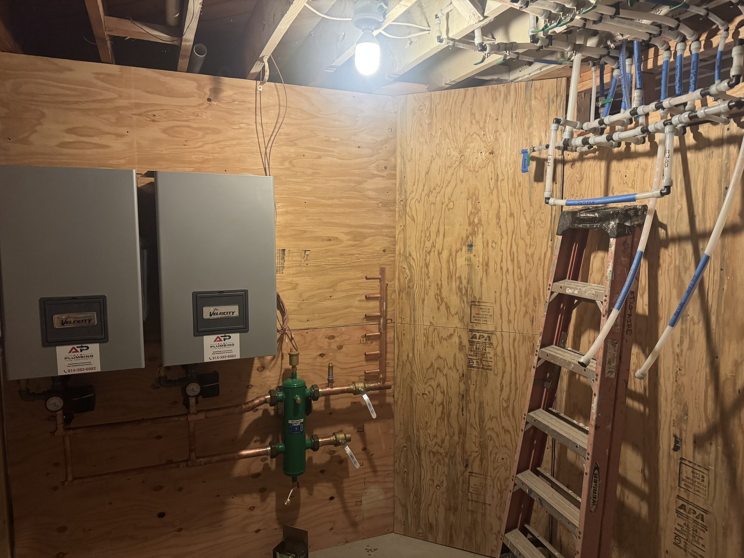 Lead-lag boiler system being installed in a Pearl River home
