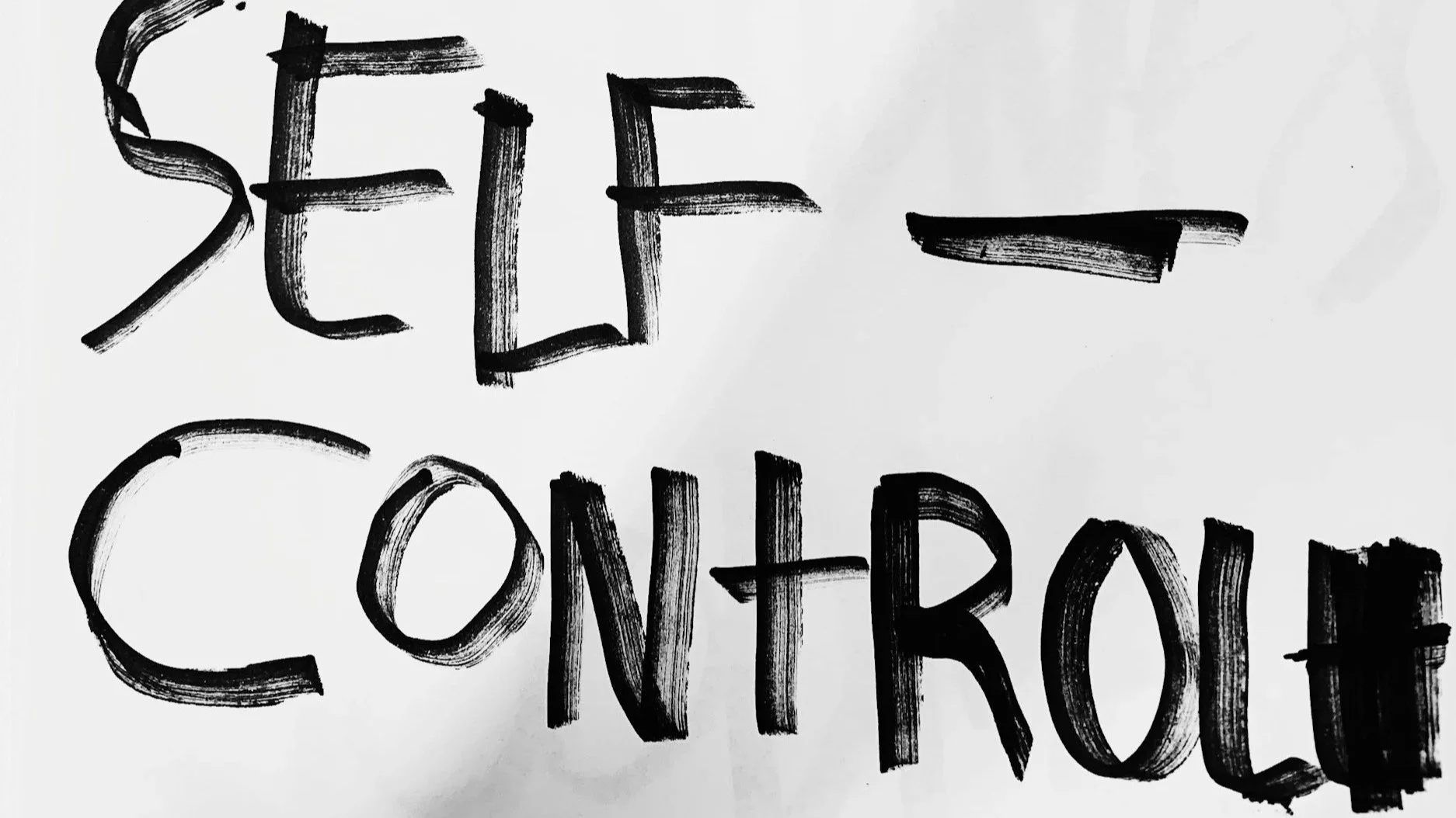 A handwritten sign in black ink on white paper that reads 'Feel Control' in large, uneven letters. Self control and control over triggers of anger