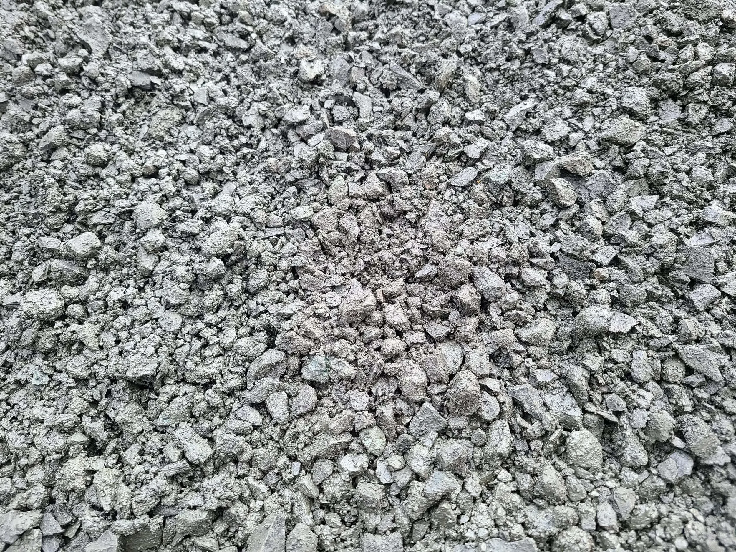 Close-up of a pile of gray crushed rocks or gravel.