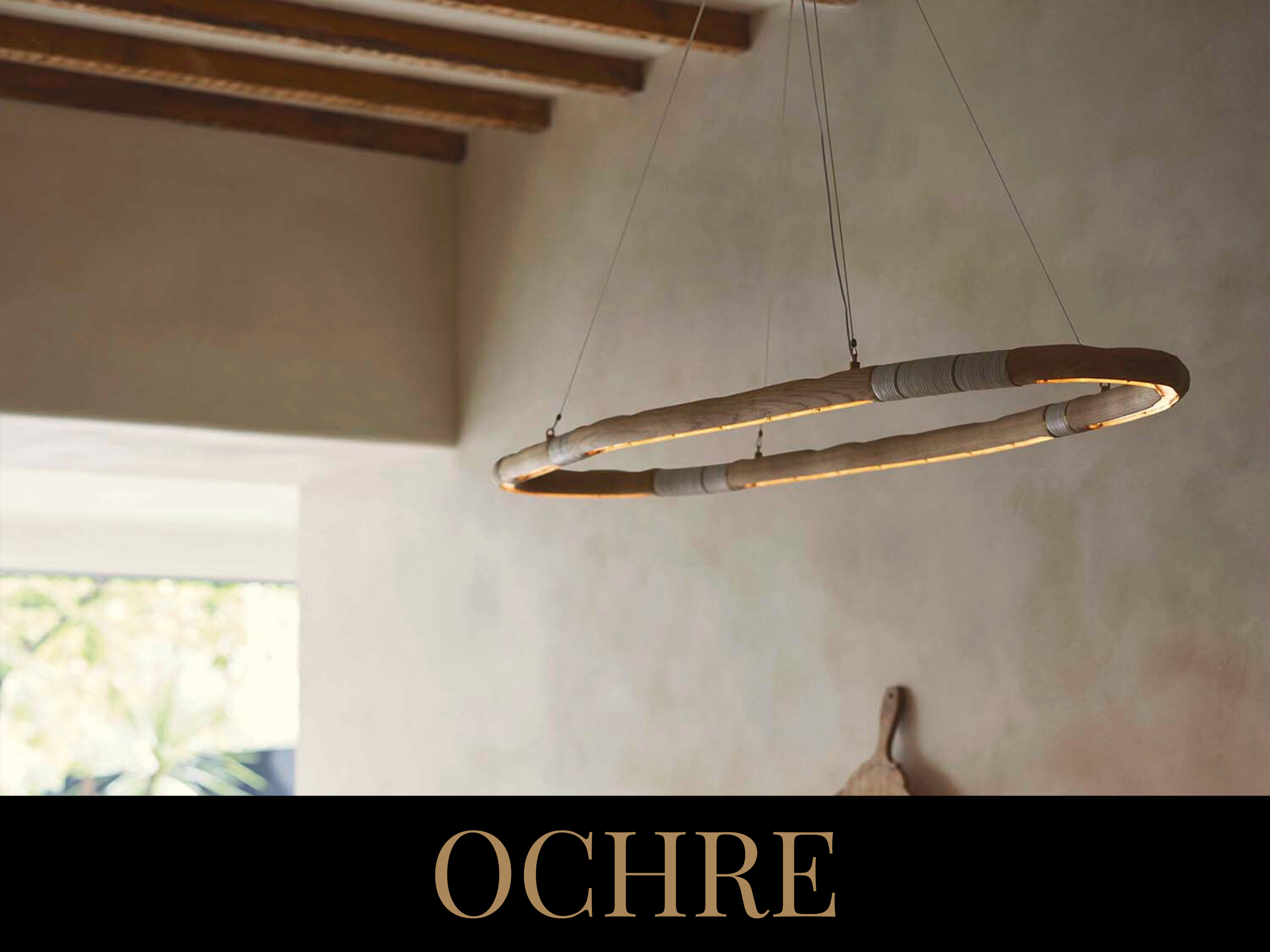 A circular modern chandelier made of a wooden ring with integrated lighting, suspended from the ceiling by four thin wires.