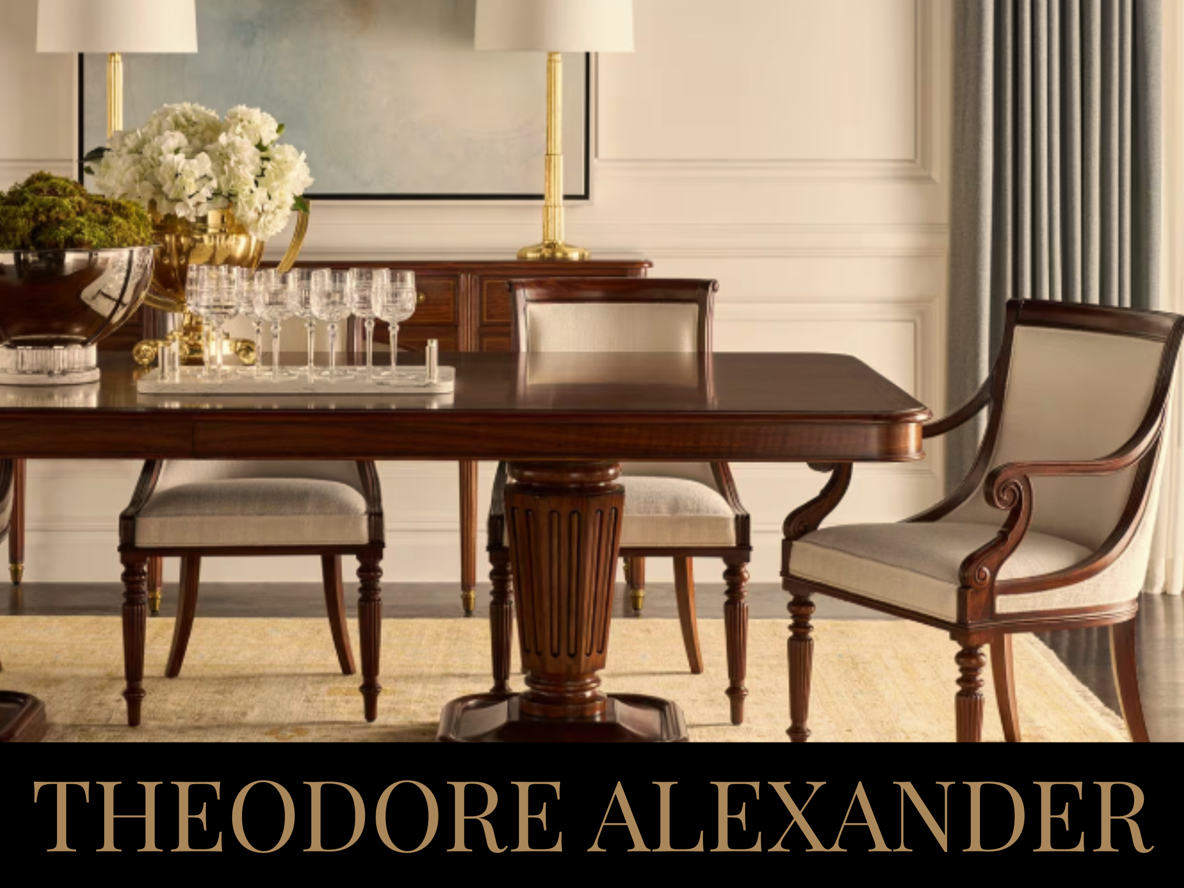 Elegant dining room with dark wooden table, beige upholstered chairs, white flowers, glassware, and gold accents