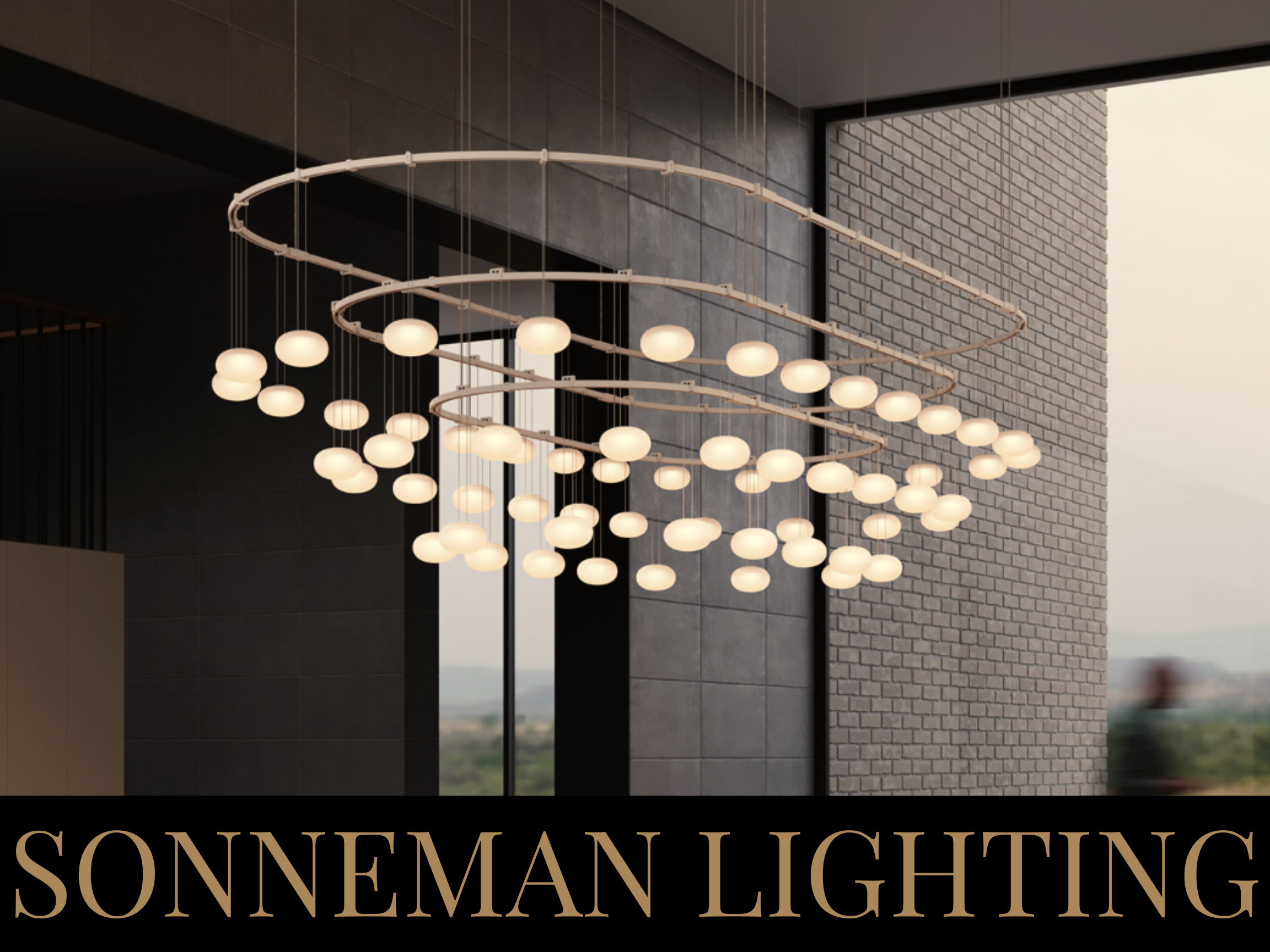 Modern chandelier with multiple circular rings and spherical white lights hanging from the ceiling in a contemporary interior with large windows and brick wall