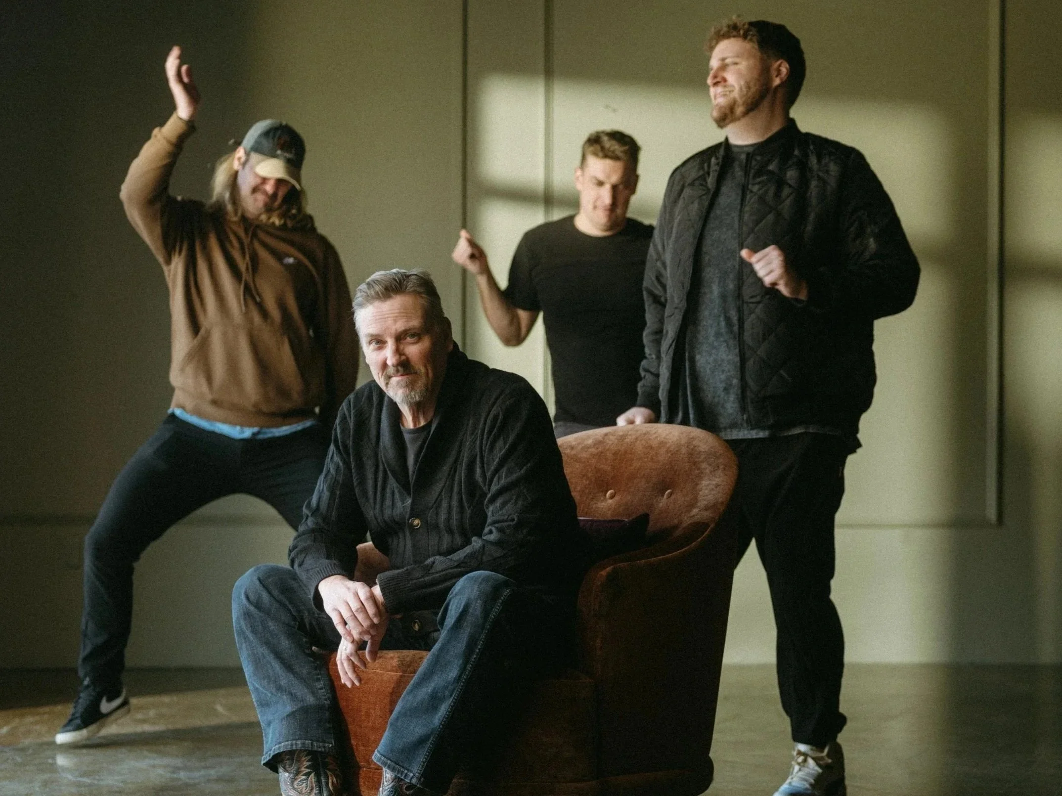 Rick Smith , COO of The Home Studio Collective, is surrounded by his sons Baylor, Coltan, and Canyon