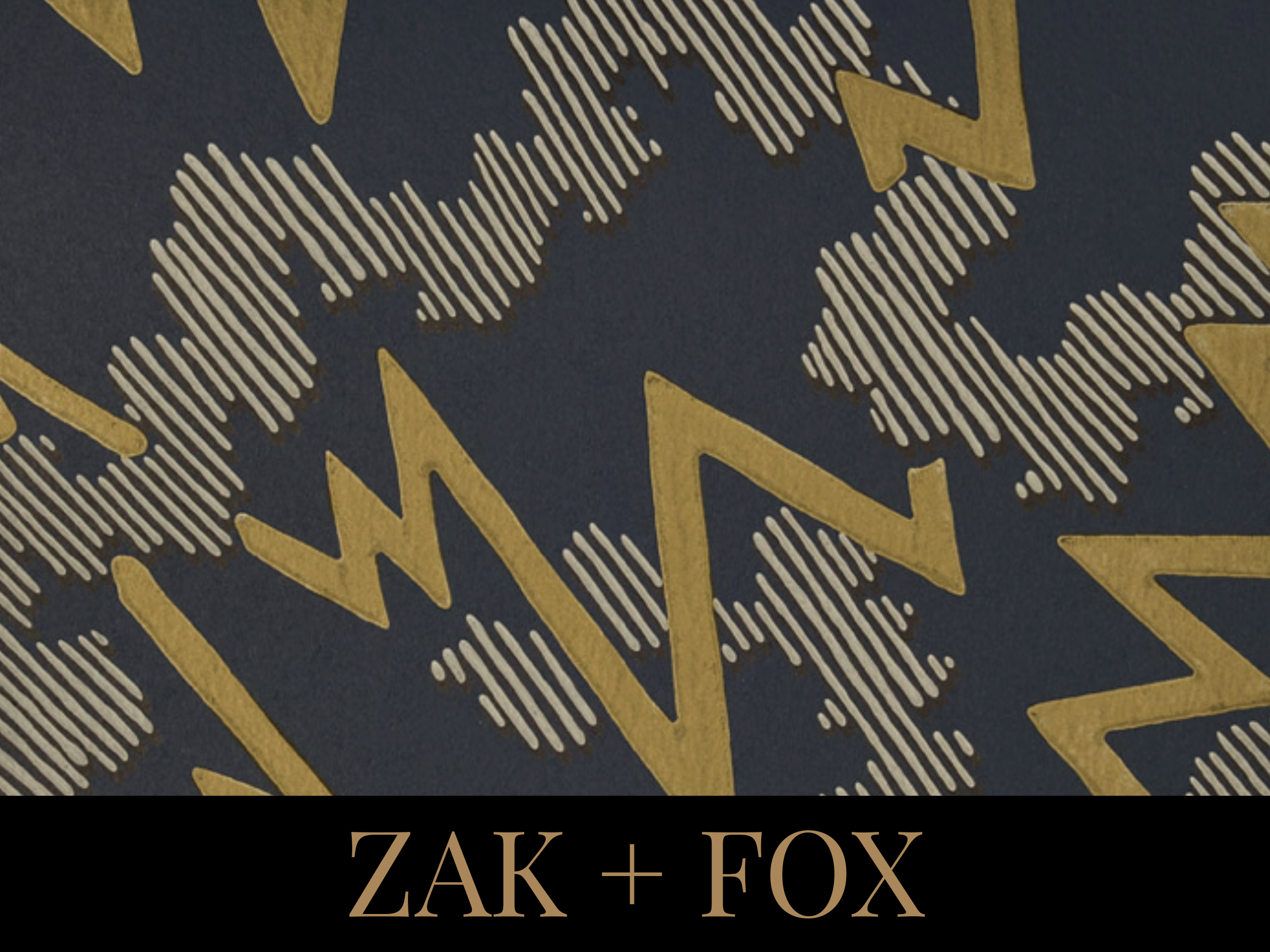 Close-up image of a dark background with golden stars and zigzag patterns, with the text 'ZAK + FOX' at the bottom.