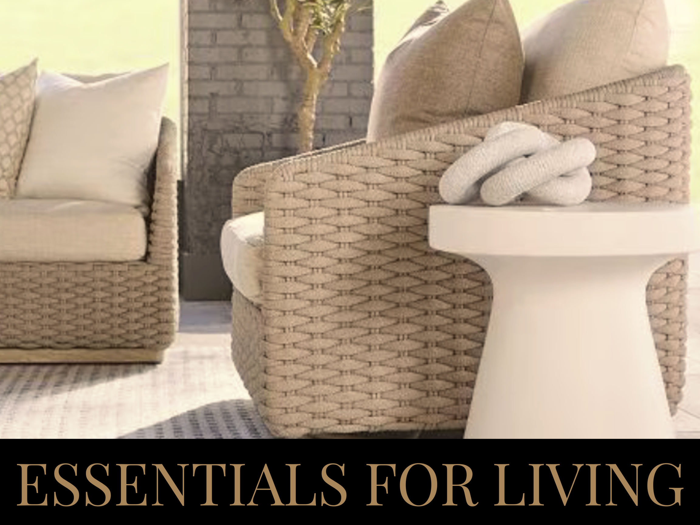 Close-up of beige woven furniture with pillows and decorative objects in a cozy living room setting, with the text 'ESSENTIALS FOR LIVING' at the bottom.