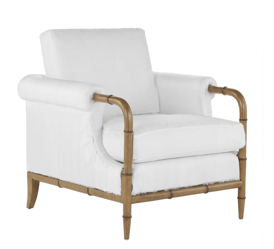White armchair with wooden bamboo-style frame and rolled arms.