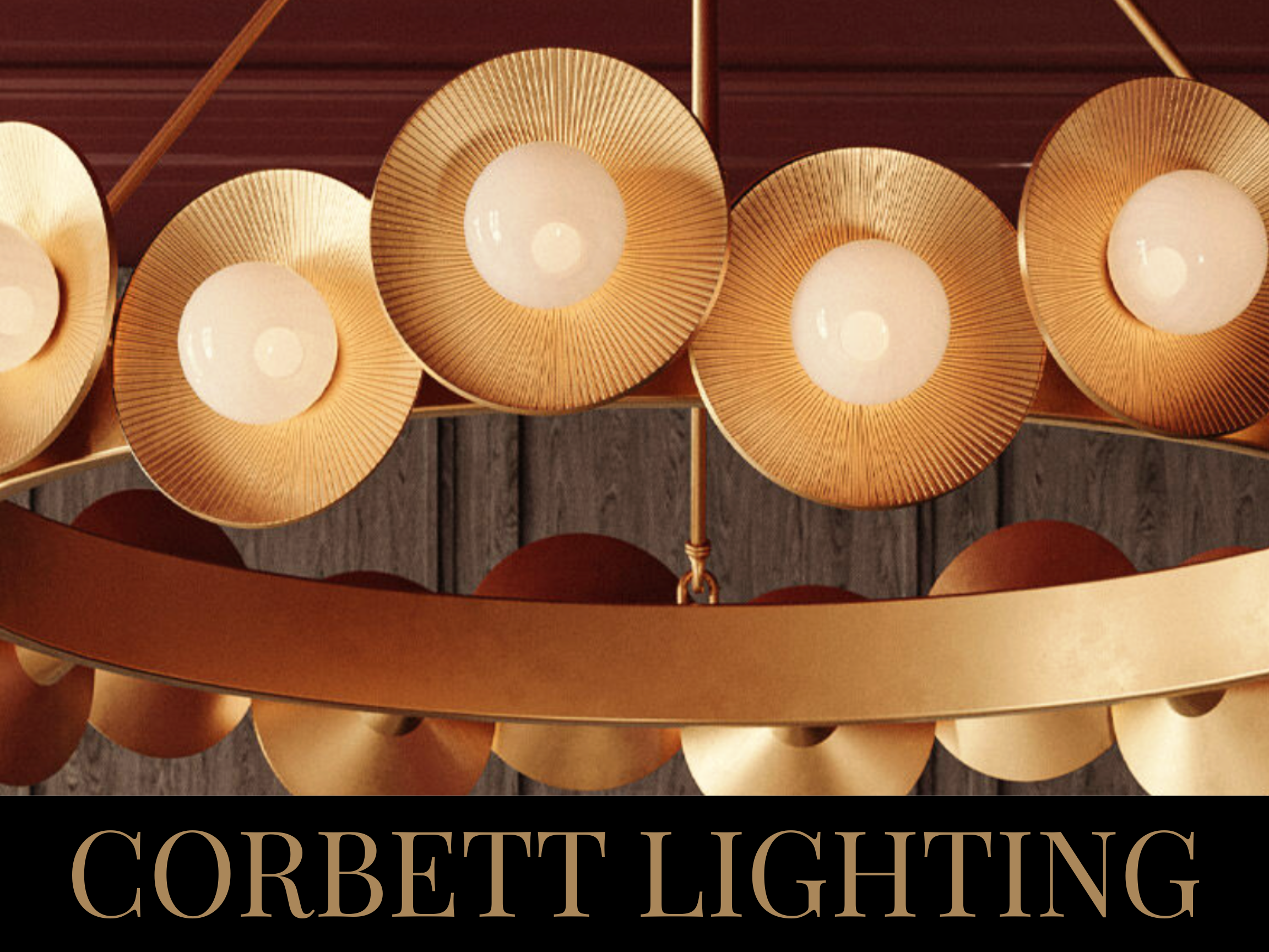Close-up of a chandelier with multiple gold, circular light fixtures hanging from a wooden ceiling, with the text 'Corbett Lighting' written at the bottom.